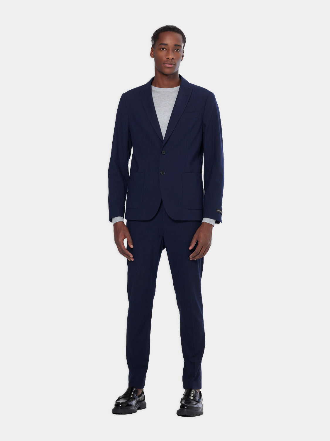 SCOTCH & SODA men's peak lapel blazer in navy, tailored fit, with structured shoulders and classic design.