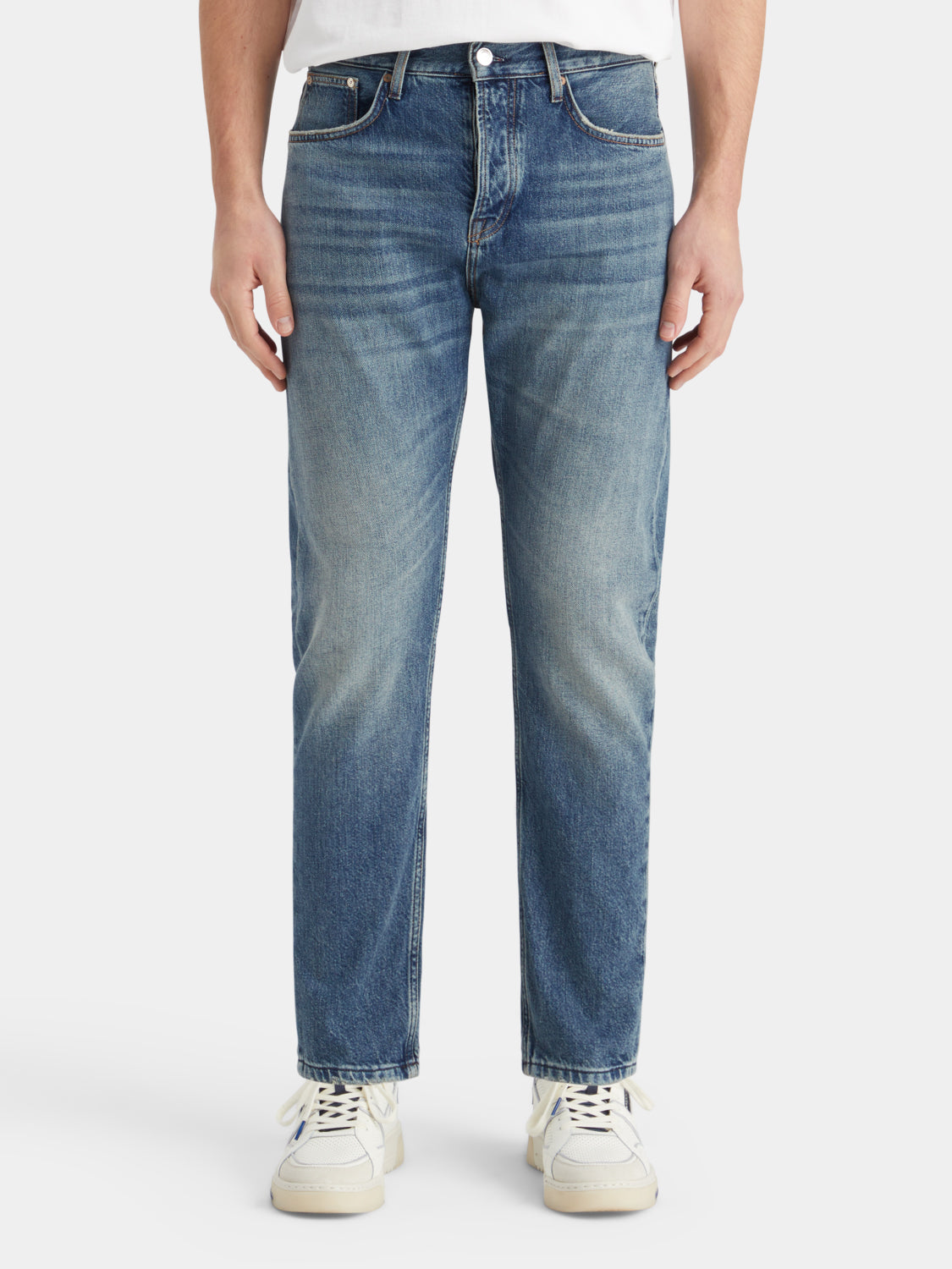 Dean tapered Scotch & Soda denim jeans, front view showing classic fit, dark wash, with visible stitching and five-pocket design.