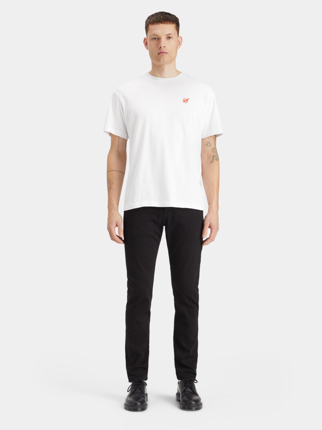 Slim-fit denim jeans by Scotch & Soda with classic five-pocket design and dark wash, shown on a model.
