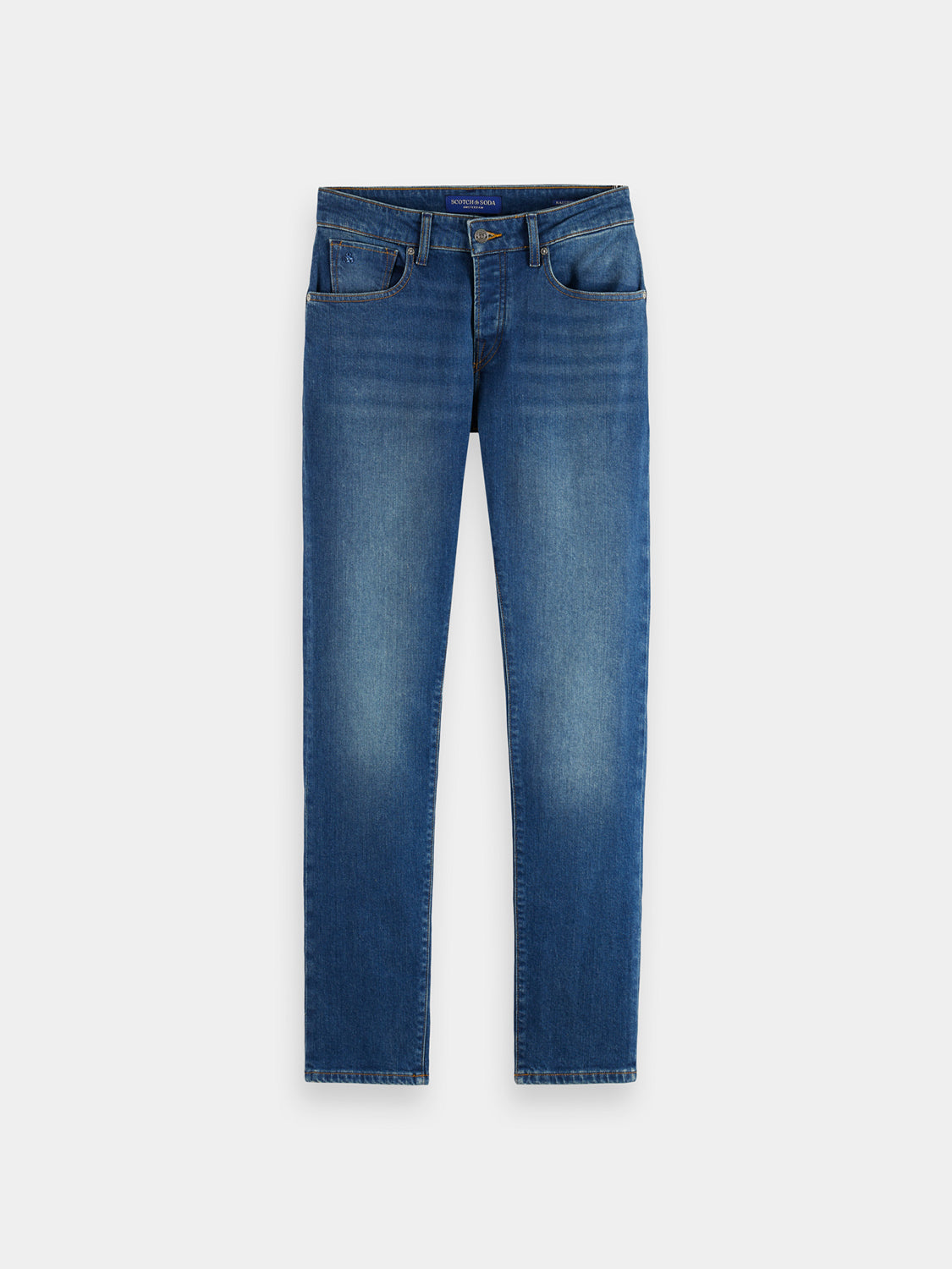 Slim-fit Ralston denim jeans by Scotch & Soda, showing classic blue fabric and modern tailored fit.