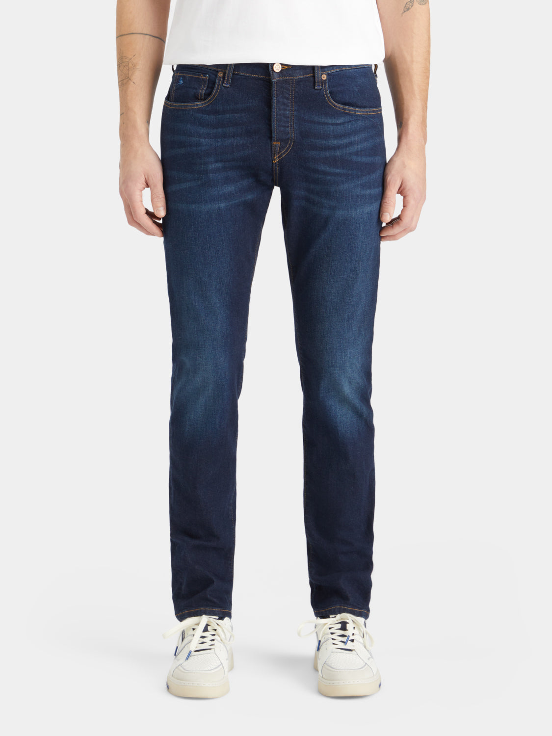 Slim-fit Ralston denim jeans by Scotch & Soda with classic five-pocket style and dark wash, displayed on a model.