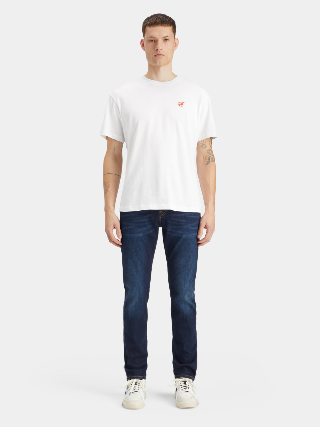 Slim-fit denim jeans from Scotch & Soda featuring classic five-pocket design and a dark wash.