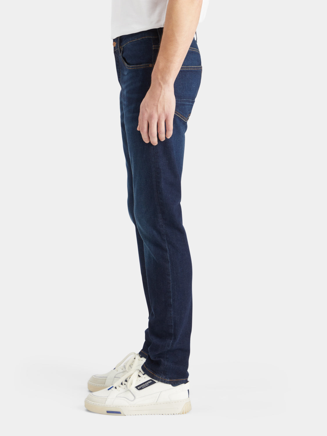 Scotch & Soda Ralston slim-fit denim jeans, front view showing classic five-pocket design and dark wash fabric.