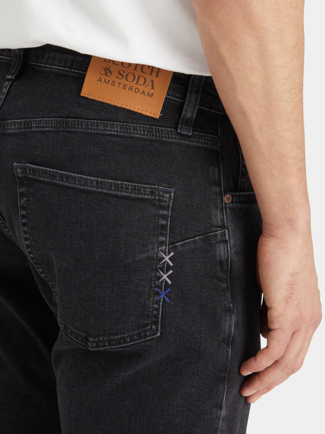 Scotch & Soda Zee straight-fit denim jeans displayed on a model, showcasing classic blue color and slim, straight-leg style.