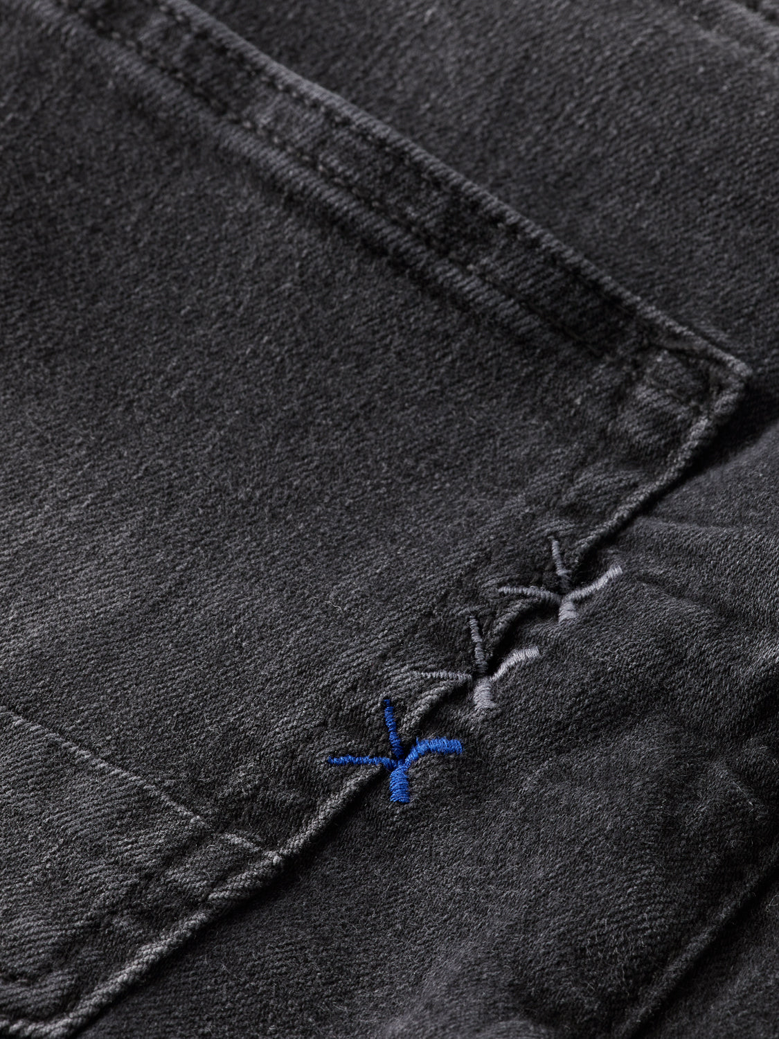Pair of Scotch & Soda Ralston slim-fit denim jeans with classic five-pocket design and dark wash.