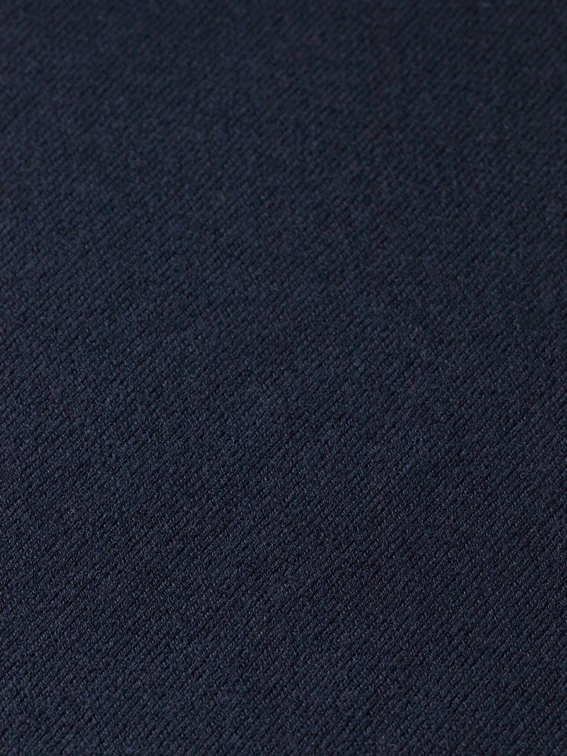 Knitwear mock neck sweater by Scotch & Soda in a neutral color, close-up view showing ribbed collar and soft fabric texture.