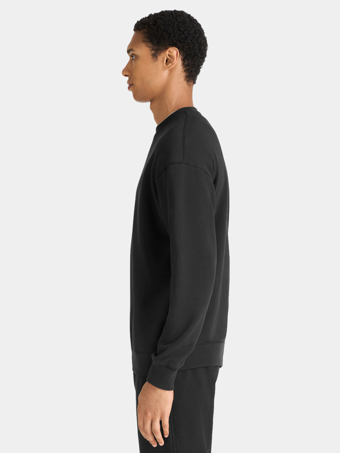 Black sweatshirt with Scotch & Soda logo print, casual fit, long sleeves, and ribbed cuffs and hem.
