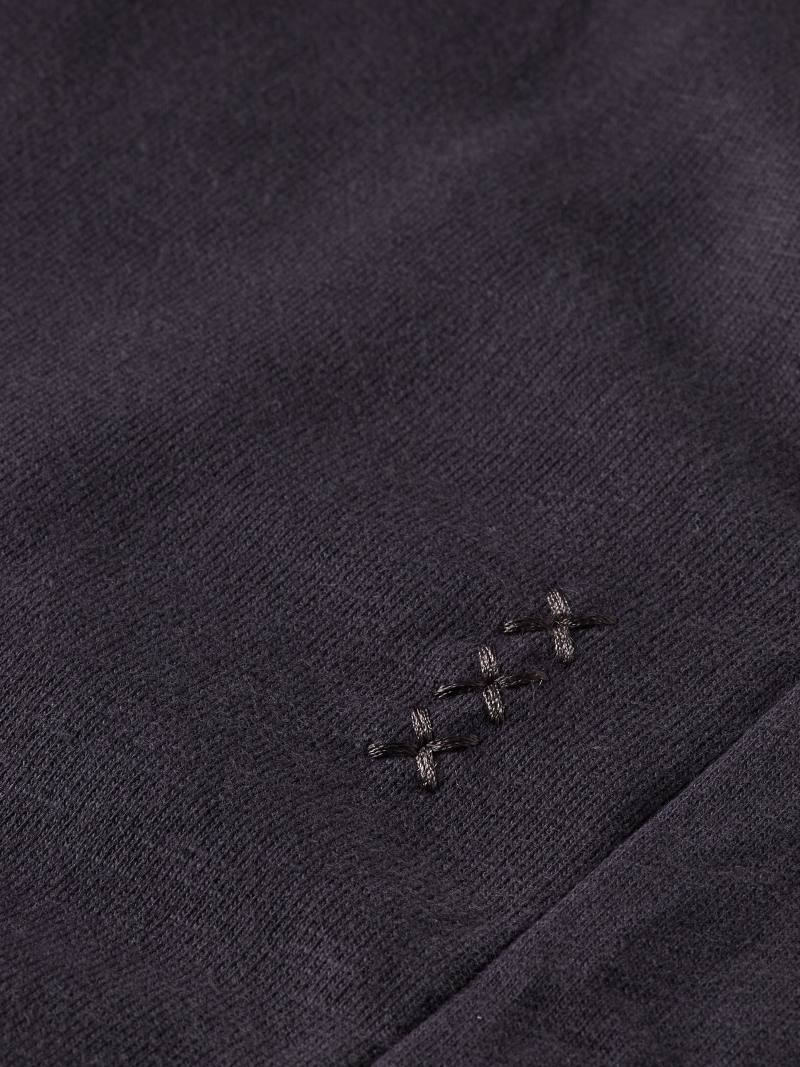 Black tapered sweatpants from Scotch & Soda with a relaxed fit, elastic waistband, and cuffed ankles.