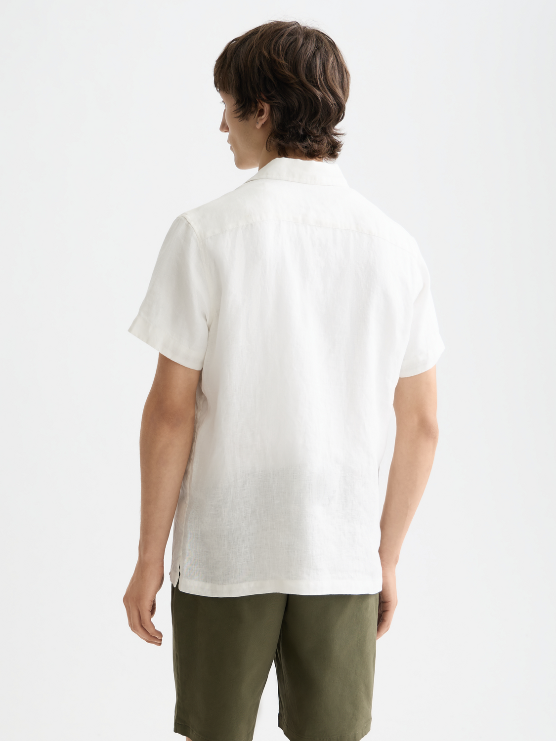 Short-sleeved linen shirt by Scotch & Soda, shown from the back with a relaxed fit and classic design.