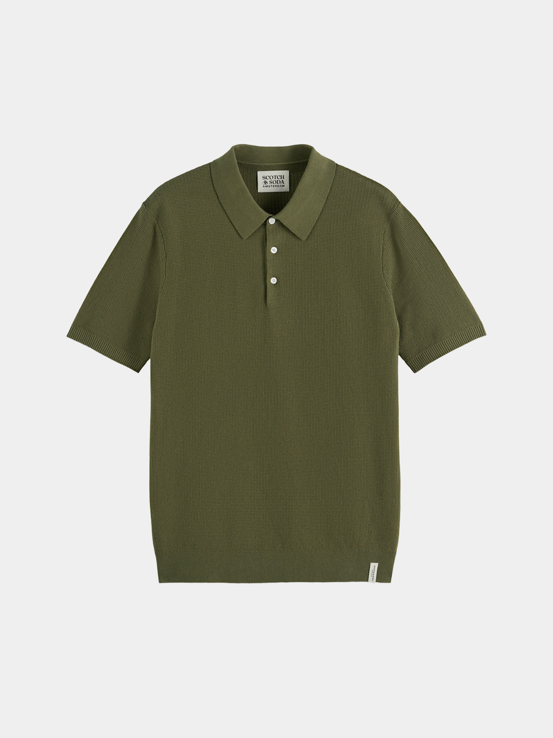 Light beige knitted polo shirt from Scotch & Soda with a classic collar and textured knit pattern.
