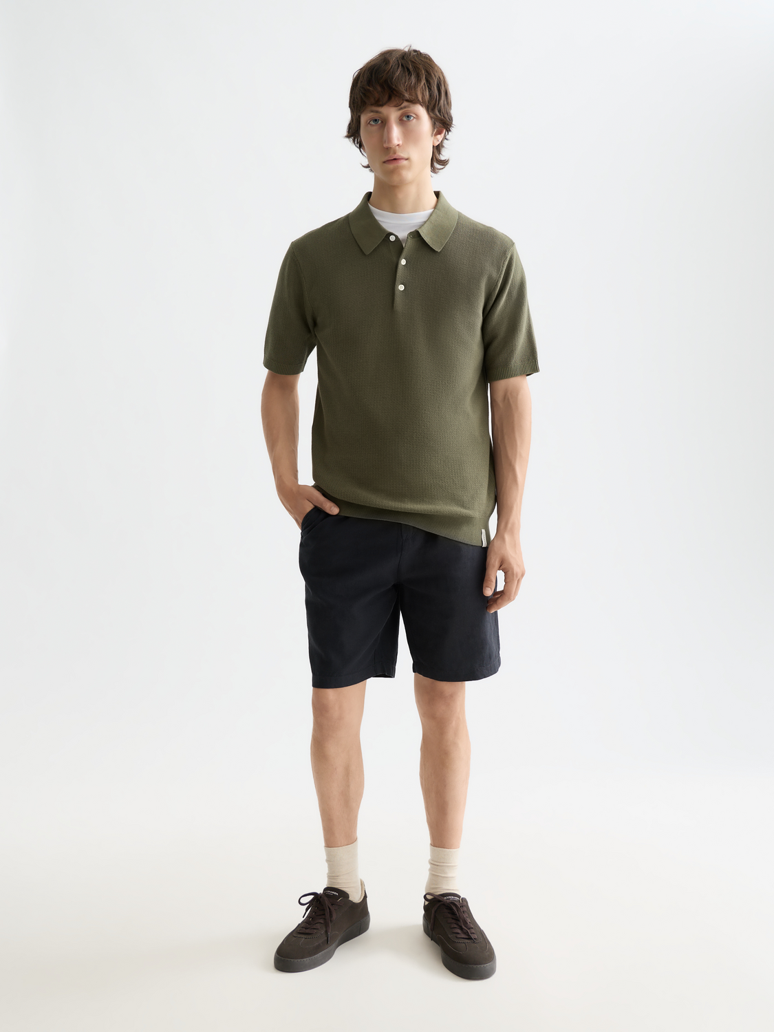 Blue knitted polo shirt by Scotch & Soda with a classic collar and textured knit fabric.