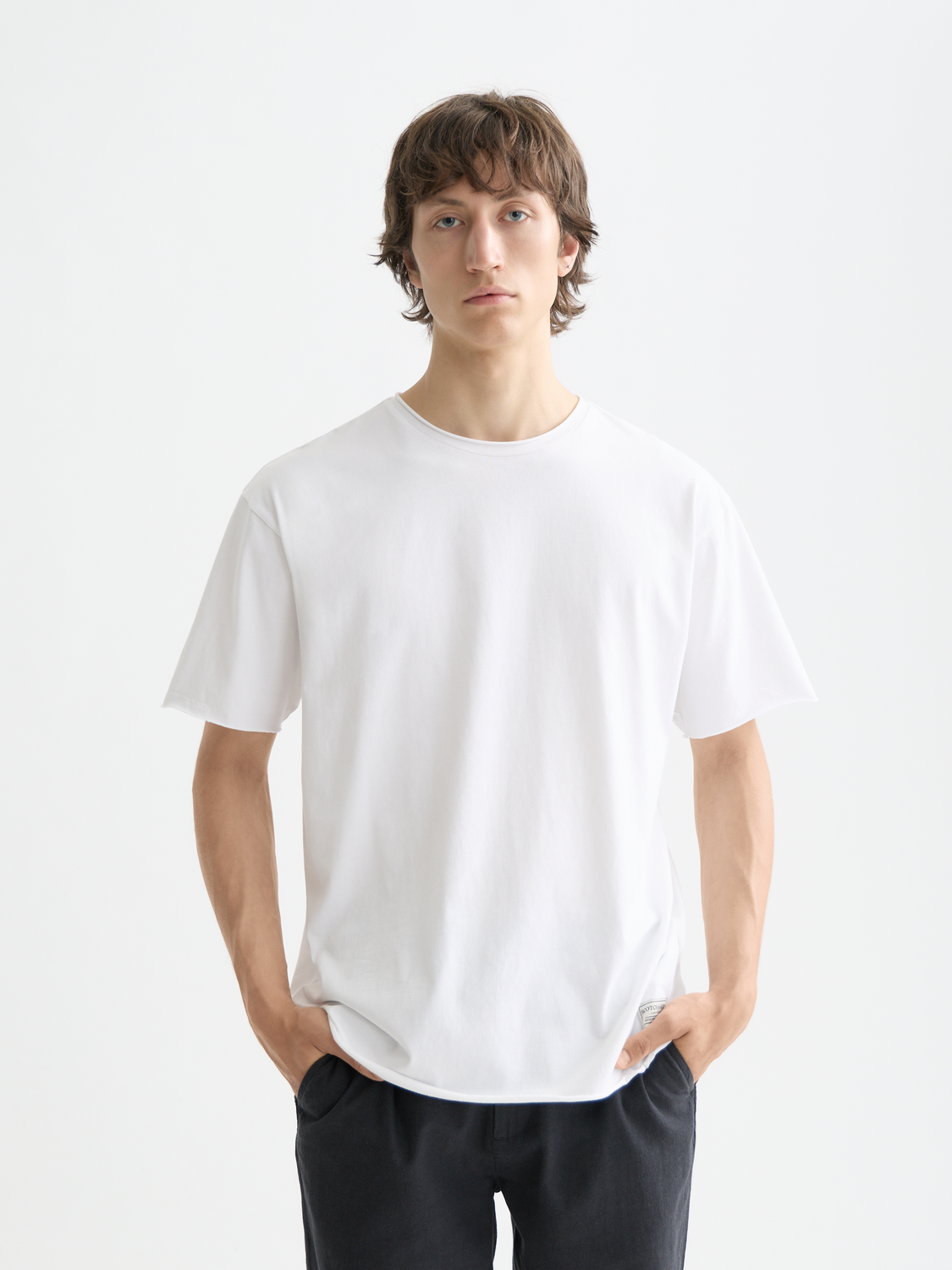 Raw-edged Scotch & Soda short-sleeve t-shirt, casual fit, front view showing distressed neckline and soft cotton fabric.