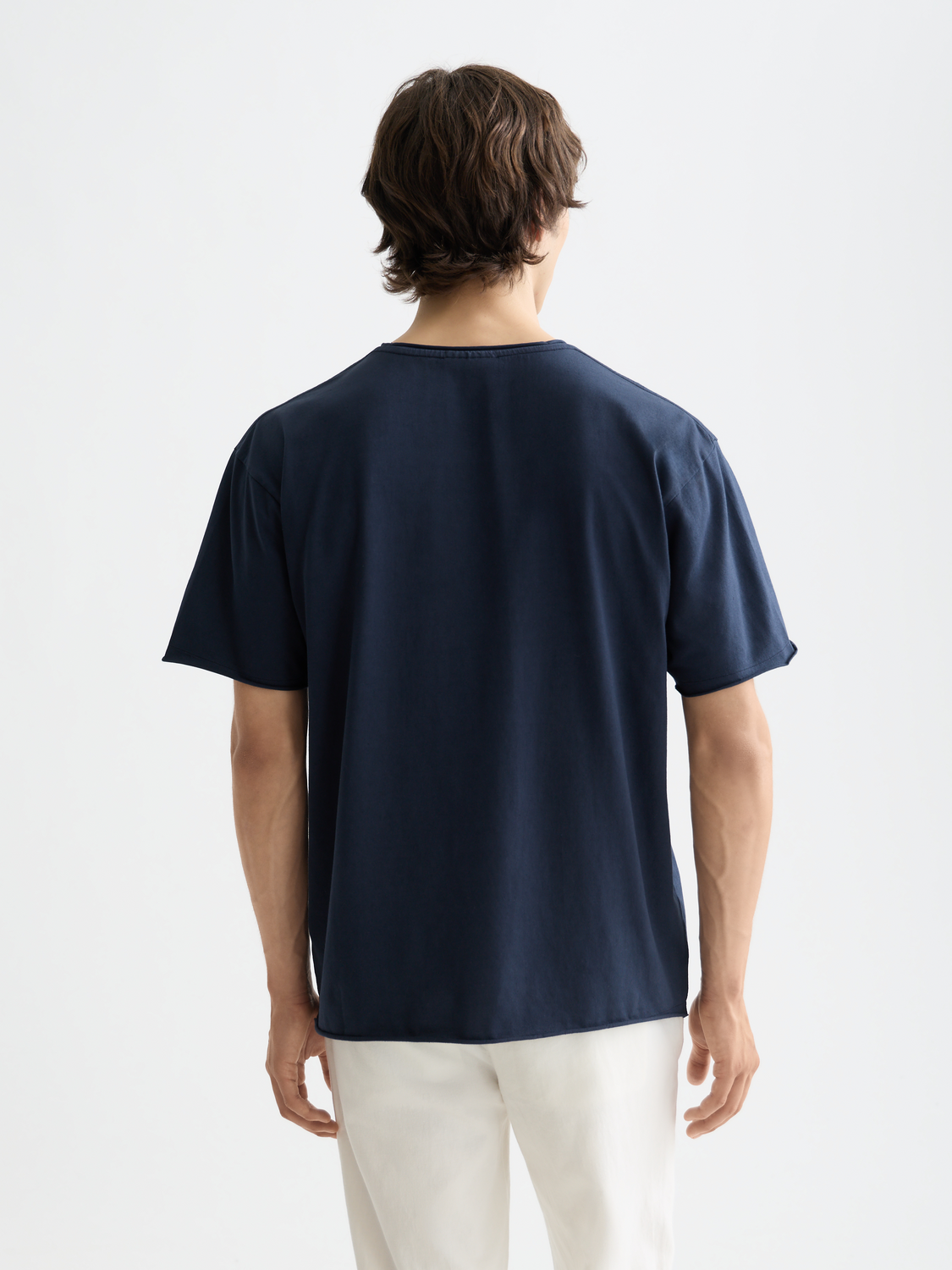 Raw-edged Scotch & Soda short sleeve t-shirt shown from the back with a relaxed fit and casual style.