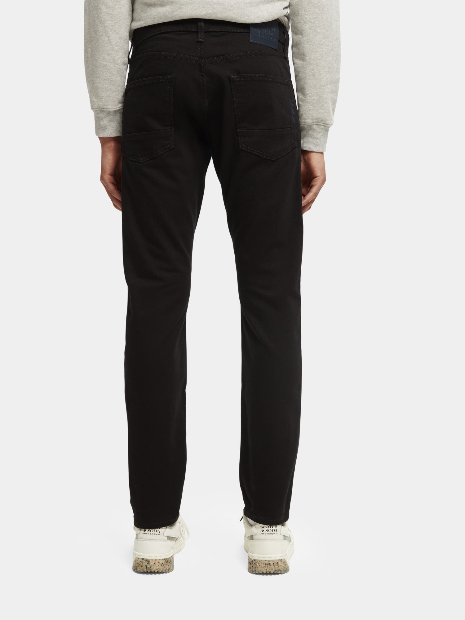 Back view of Scotch & Soda Ralston slim fit denim jeans showing dark wash fabric and classic five-pocket design.