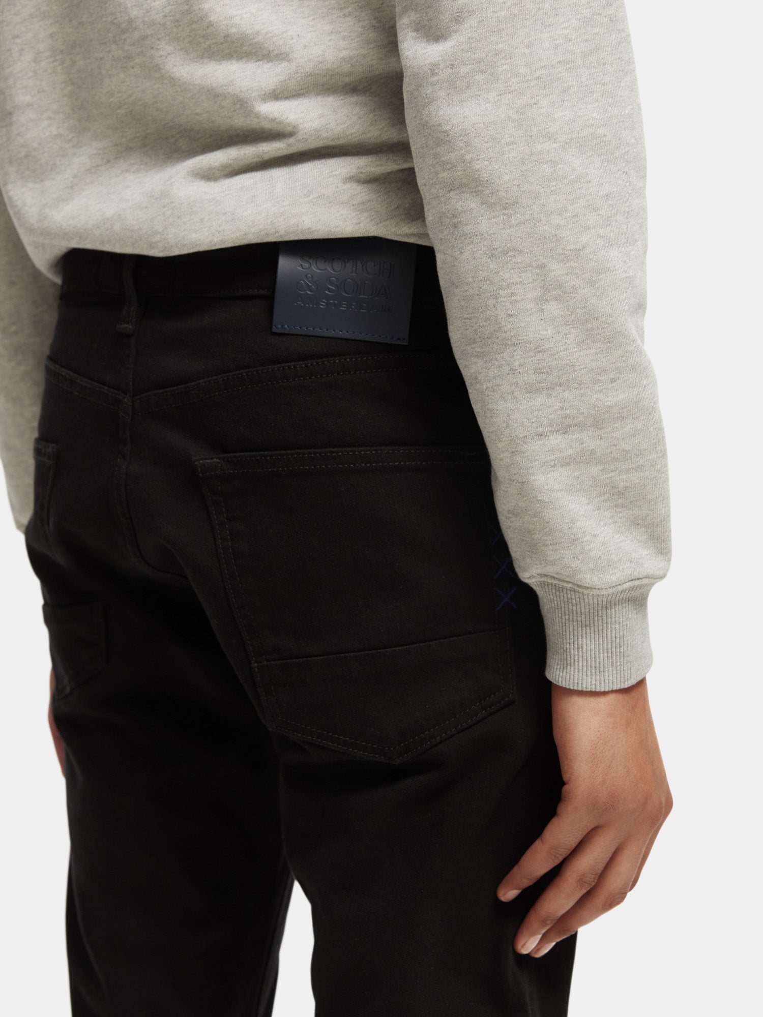 Scotch & Soda Ralston slim fit denim jeans displayed on a model, showcasing classic style and modern fit.