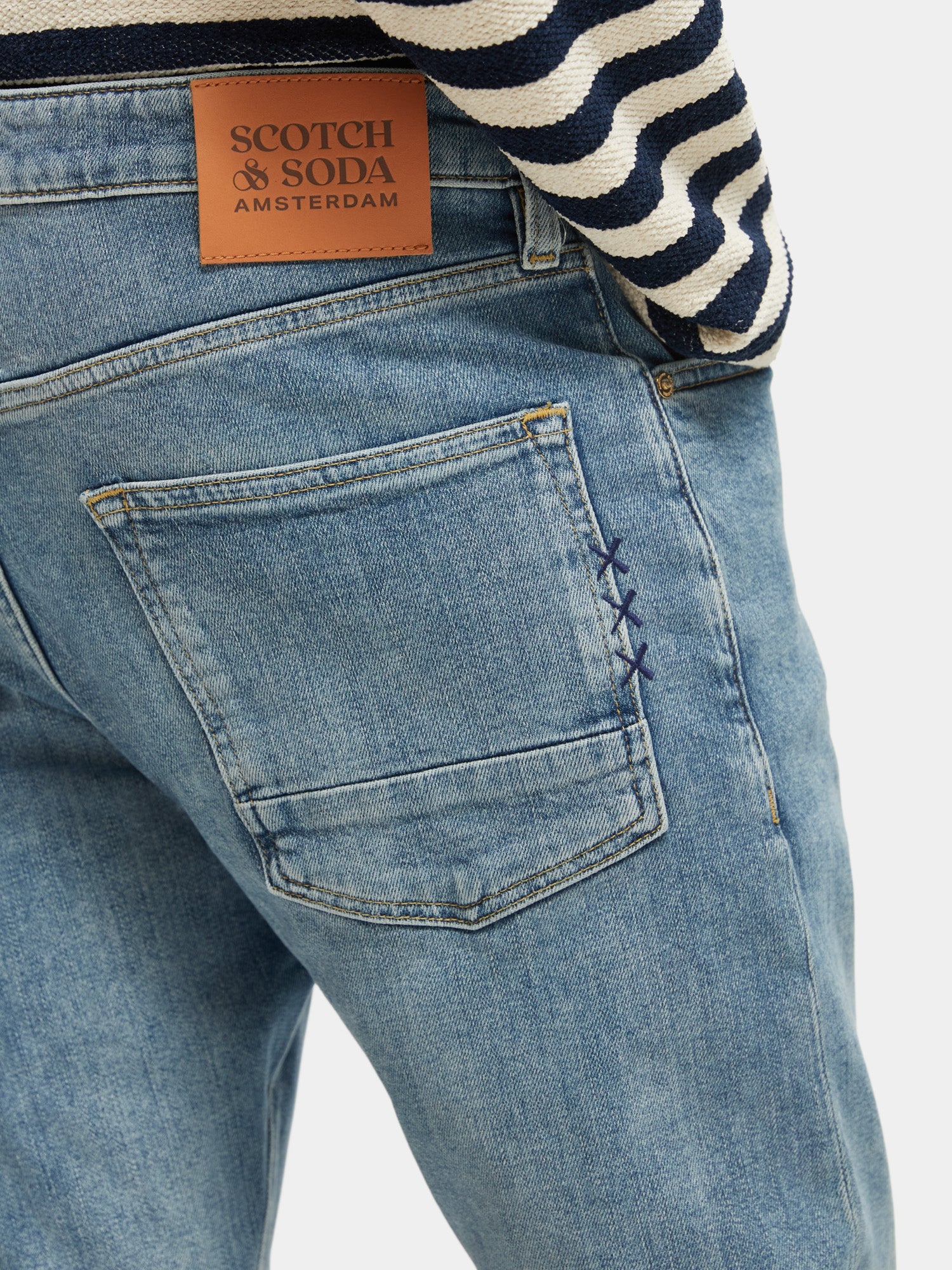 Slim fit Scotch & Soda denim jeans from Ralston collection, showcasing classic five-pocket design and dark wash finish.