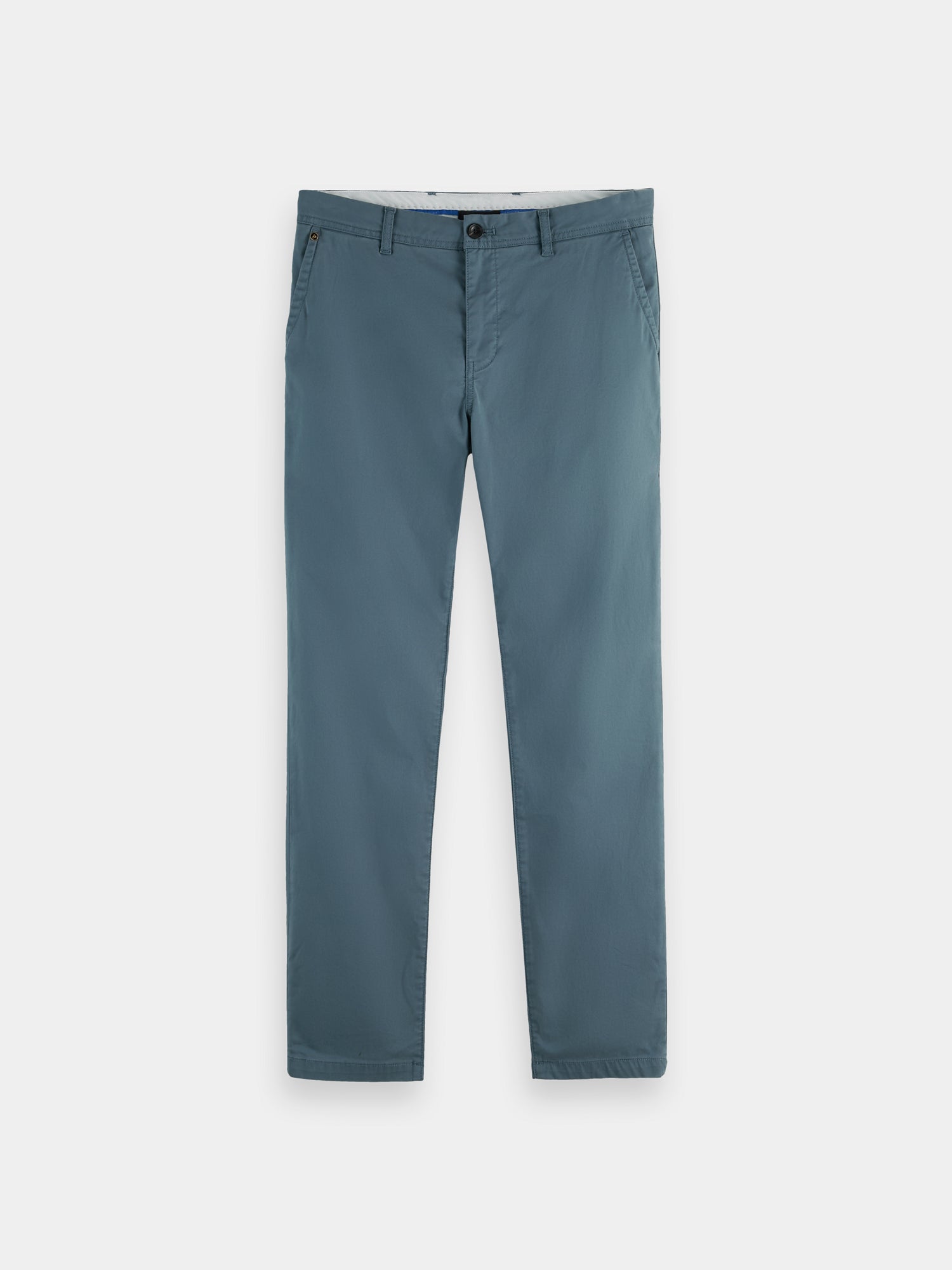 Slim fit Scotch & Soda Stuart chinos in a neutral color, shown folded with a close-up of fabric texture and stitching details.