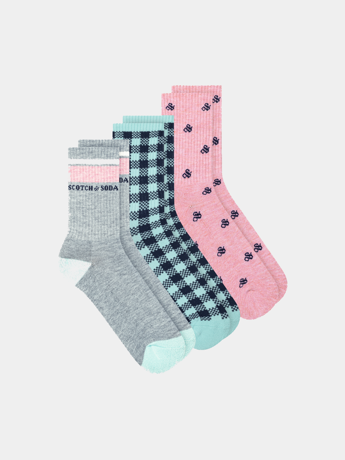 Three pairs of kids' crew socks by Scotch & Soda featuring colorful patterns and soft fabric for comfortable wear.