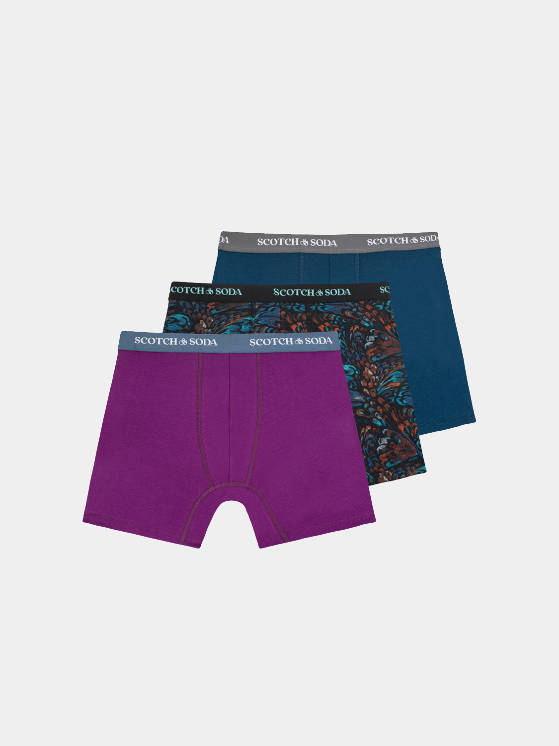 Three-pack Scotch & Soda men's boxer briefs with elastic waistband and soft fabric, displayed in a casual pose.