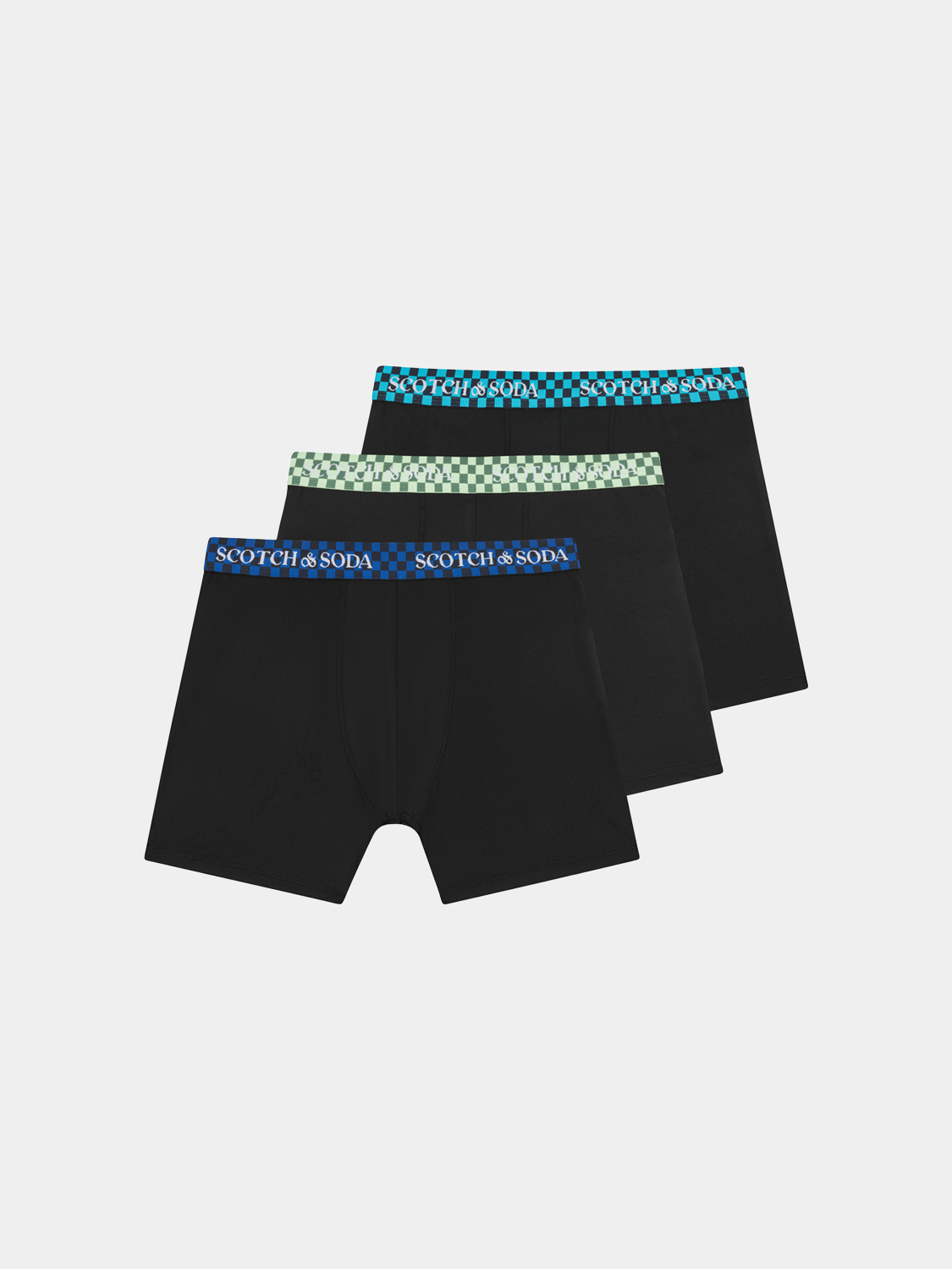 Three-pack Scotch & Soda men's boxer briefs in various colors, close-up view of the comfortable underwear fit and fabric.