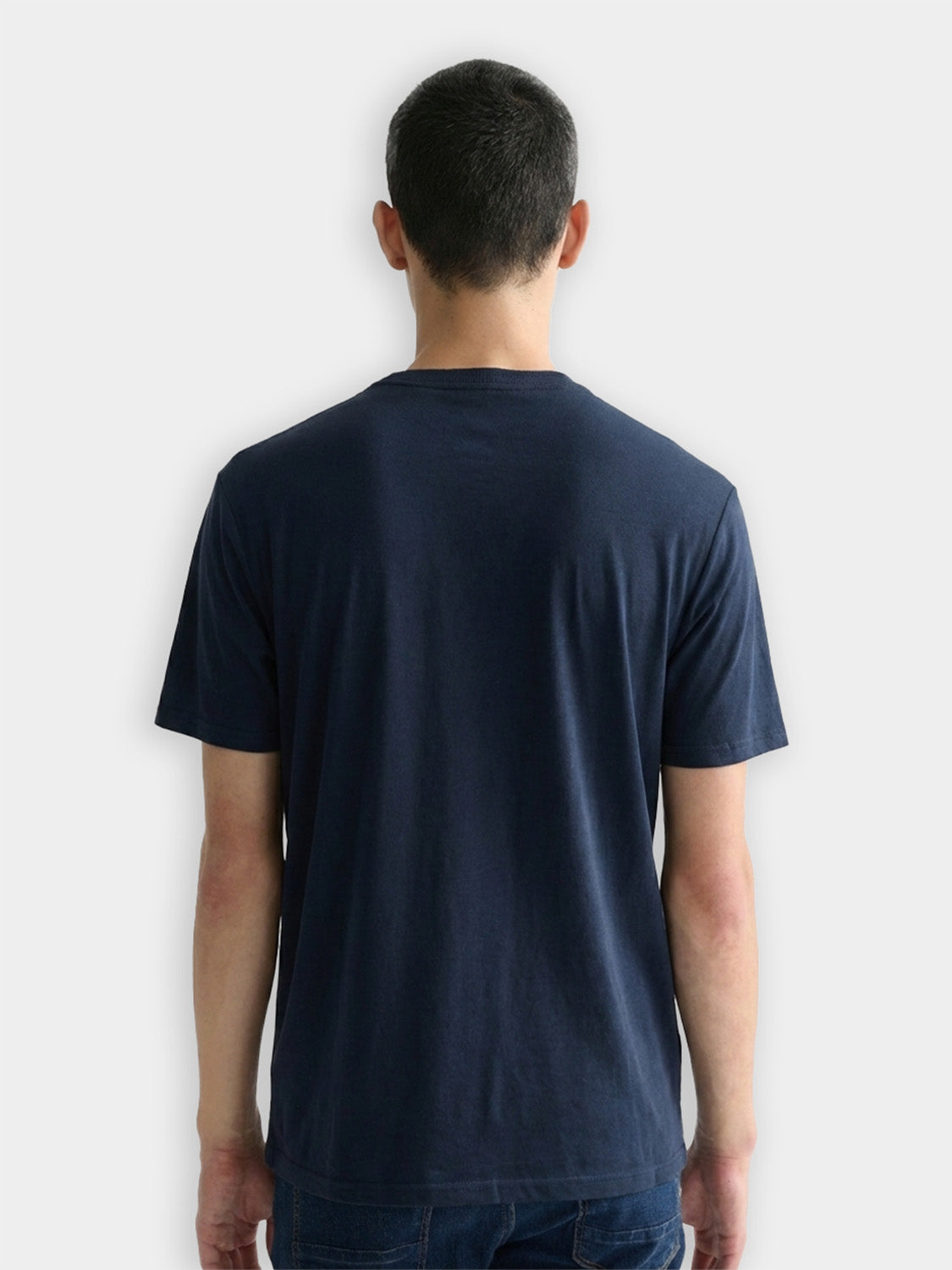 Three black crew neck T-shirts from Scotch & Soda, short-sleeve casual tees, folded and stacked for display.