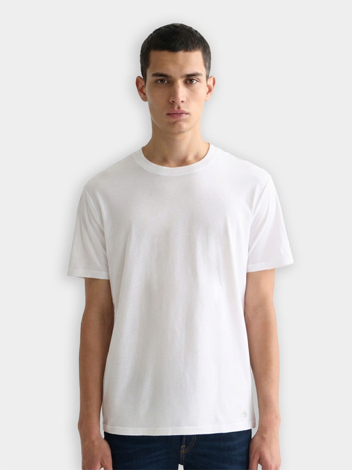 Three Scotch & Soda men's crew neck short-sleeve T-shirts in various colors, front view showing soft cotton fabric.