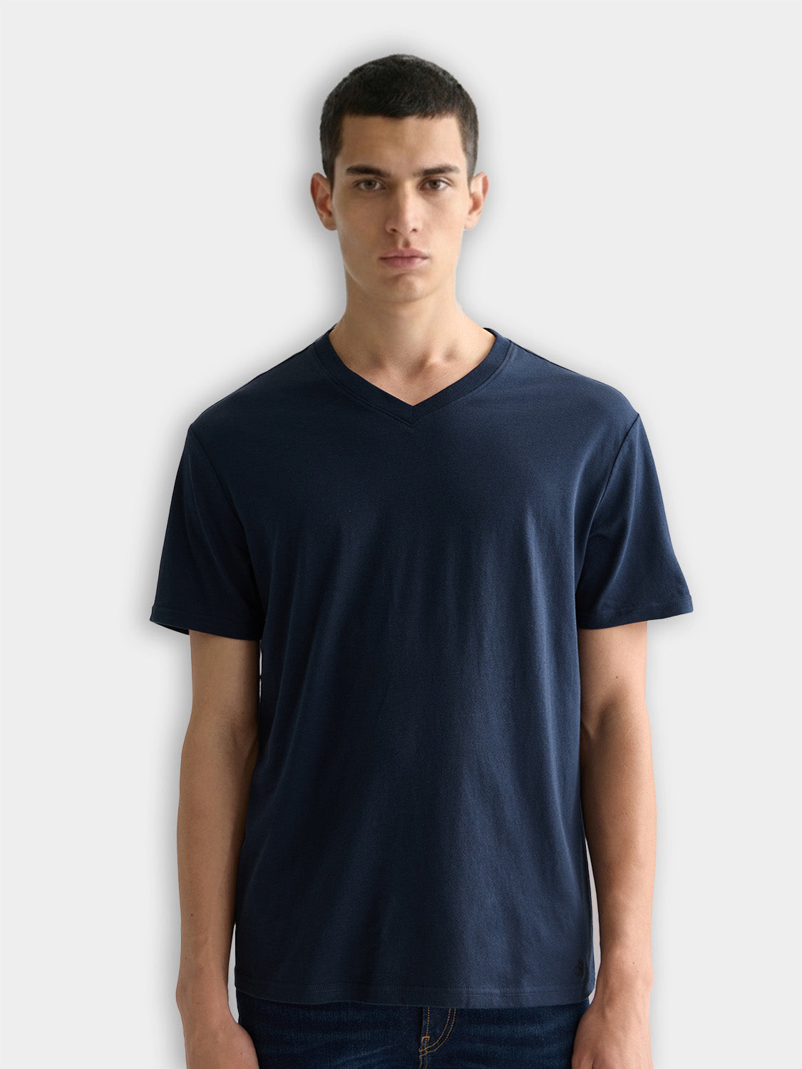 Three Scotch & Soda short-sleeve V-neck T-shirts in neutral colors, displayed flat for a clean, modern look.
