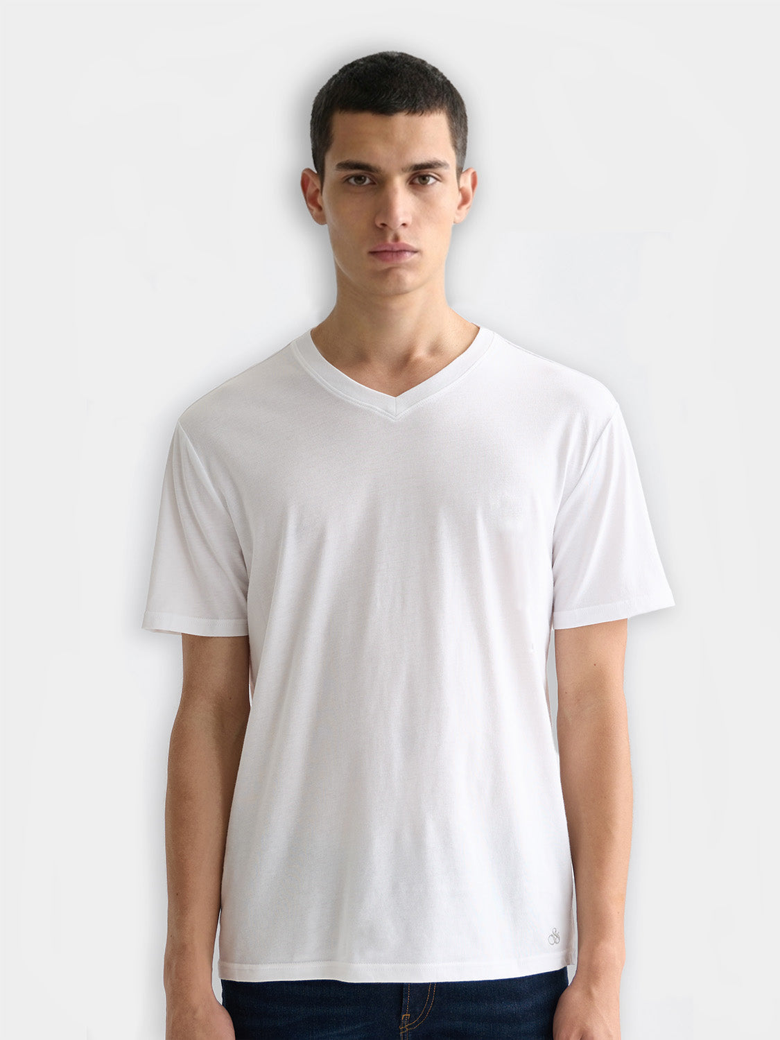 Three Scotch & Soda short sleeve v-neck t-shirts in neutral colors, displayed flat with front view.