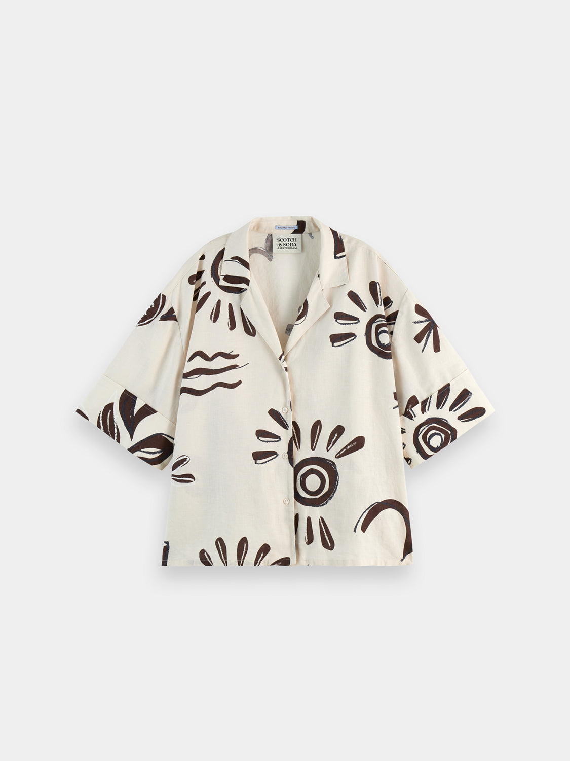 Printed short-sleeved shirt from Scotch & Soda featuring a vibrant floral pattern and classic fit, displayed on a hanger.