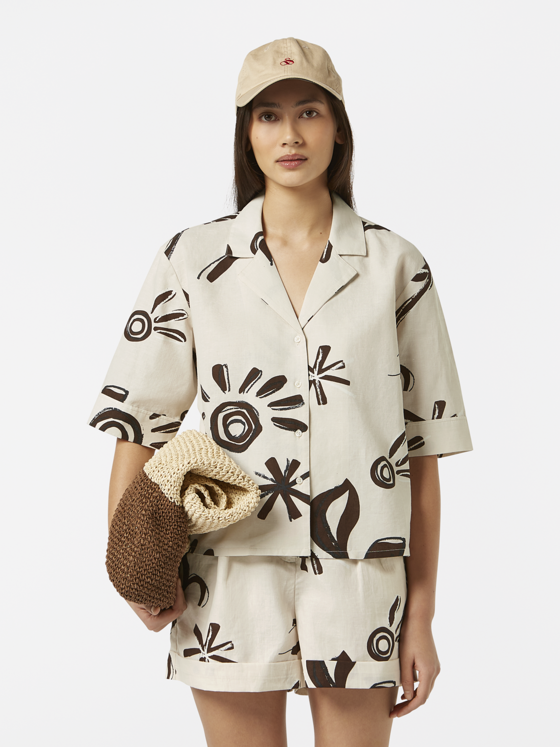 Printed short-sleeved shirt from SCOTCH & SODA featuring a vibrant floral pattern on lightweight fabric.