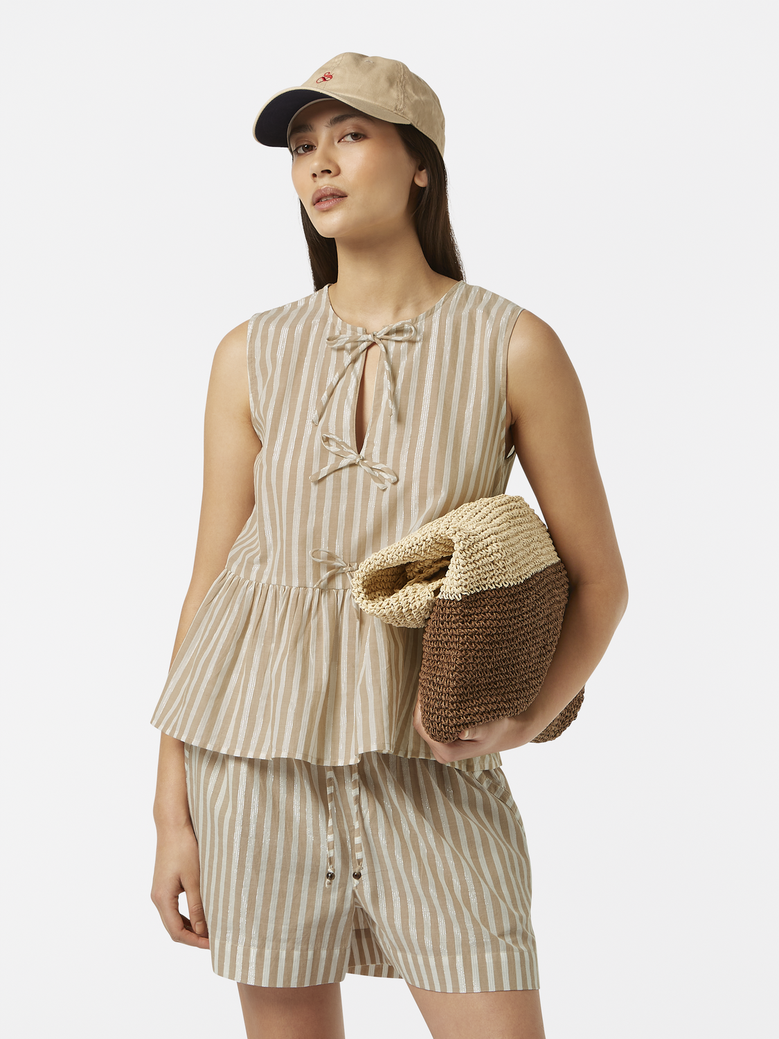 Light blue Scotch & Soda bow top tank with ruffled straps and relaxed fit, displayed on a mannequin.