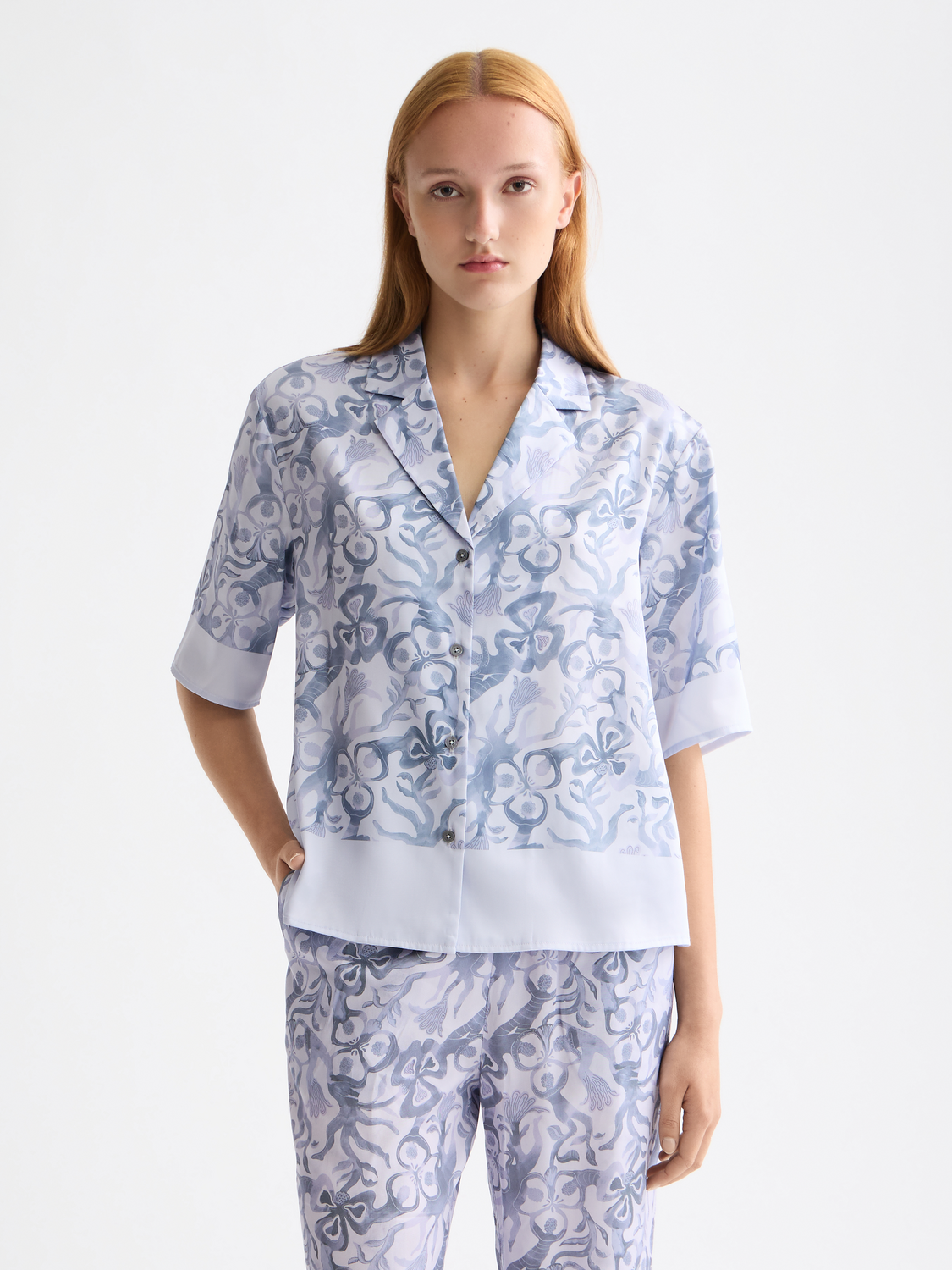 Printed short-sleeved shirt from Scotch & Soda featuring a vibrant, colorful pattern on lightweight fabric.