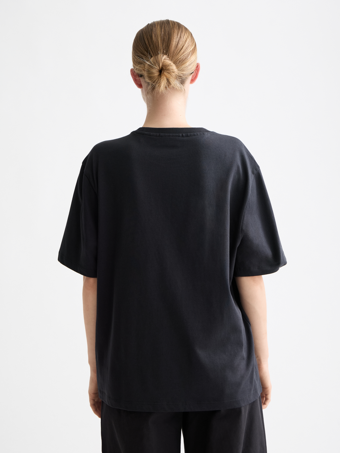 Scotch & Soda artwork short sleeve t-shirt featuring colorful graphic print on black fabric.