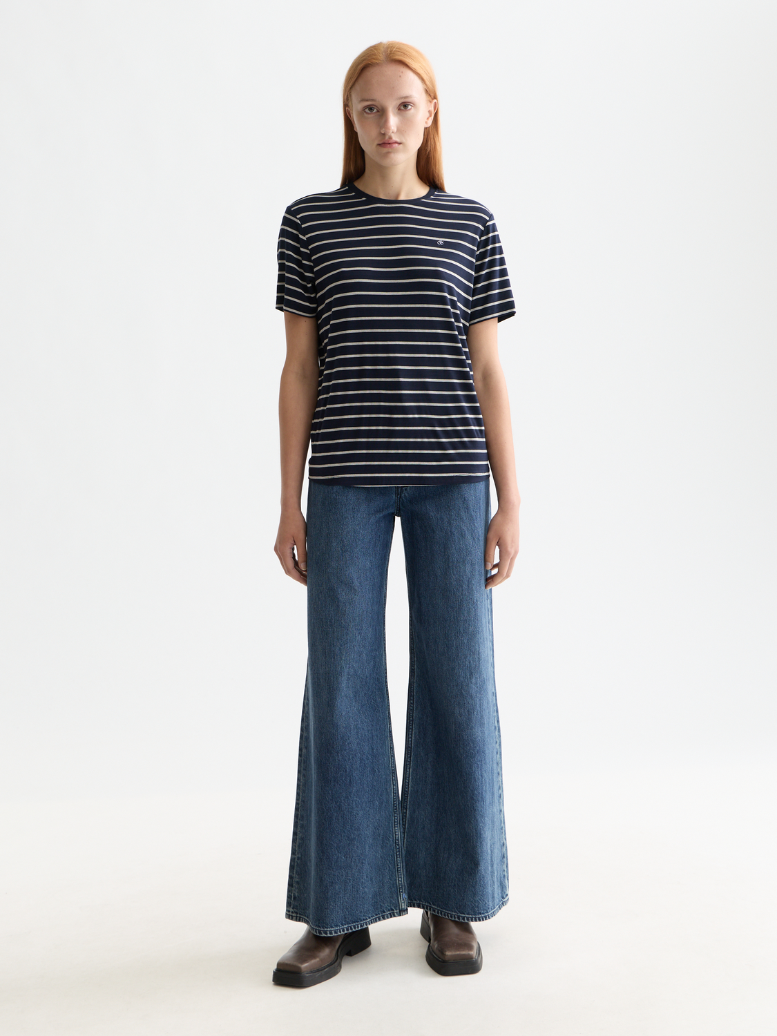 Striped Scotch & Soda short-sleeve t-shirt with blue and white horizontal stripes, front view on a model.