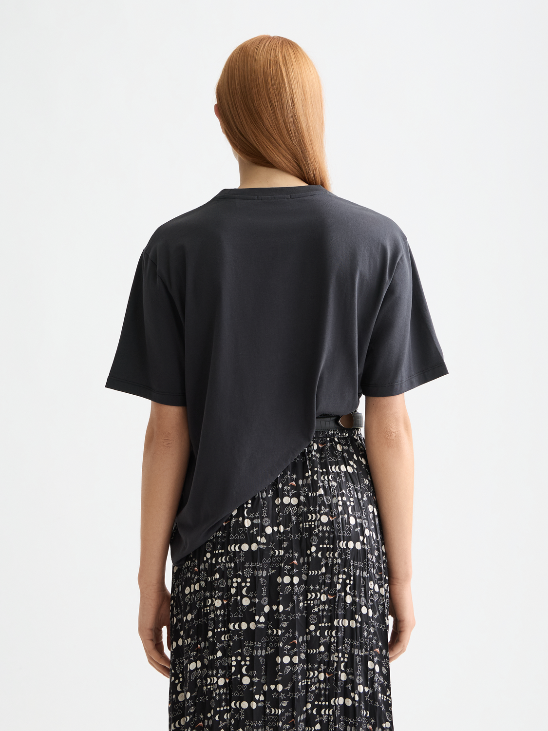Black artwork t-shirt by Scotch & Soda featuring a graphic design on the front, short sleeve casual tee for everyday wear.