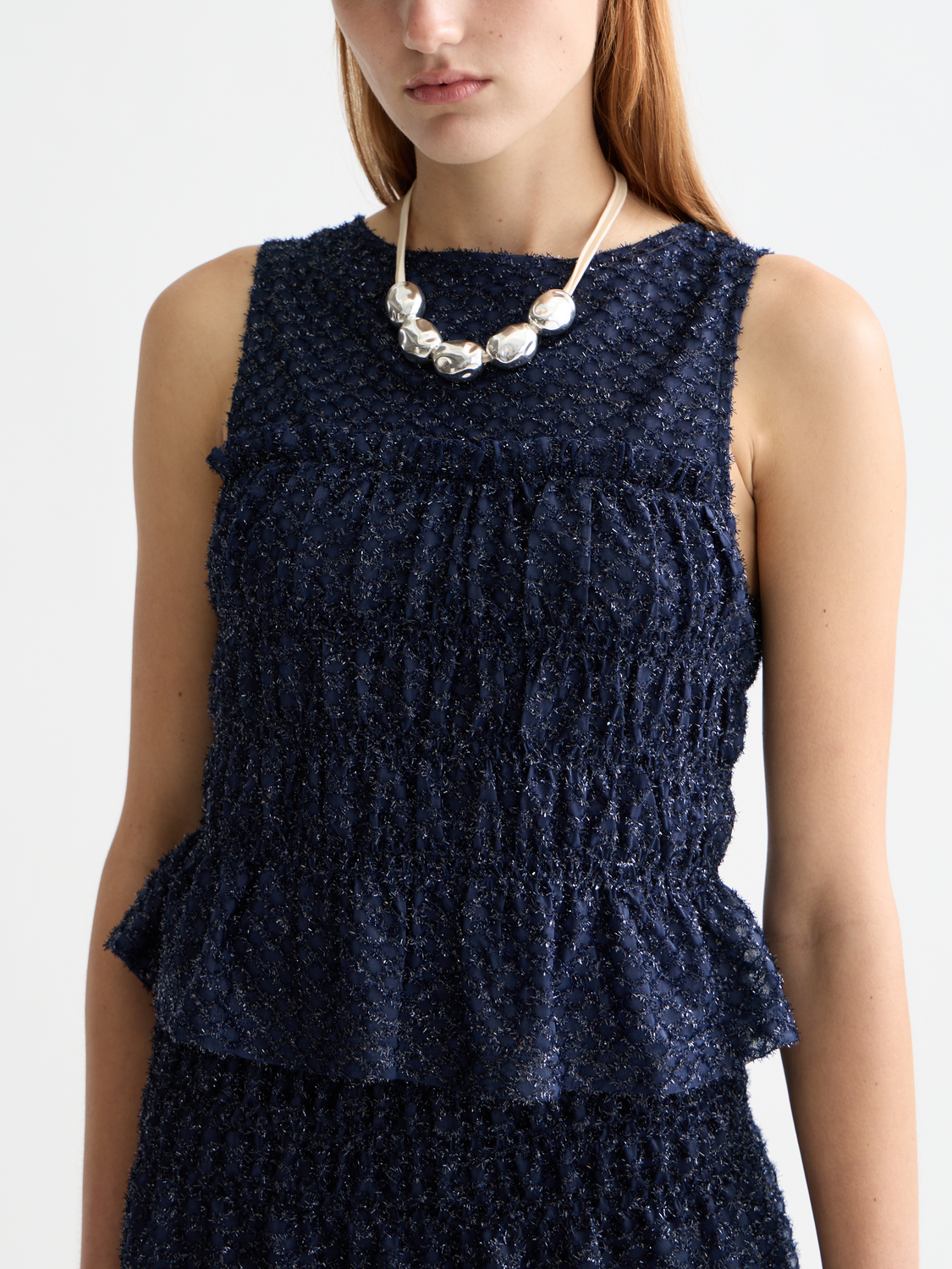 Smocked tank top by Scotch & Soda featuring a fitted design and soft fabric, shown on a model.