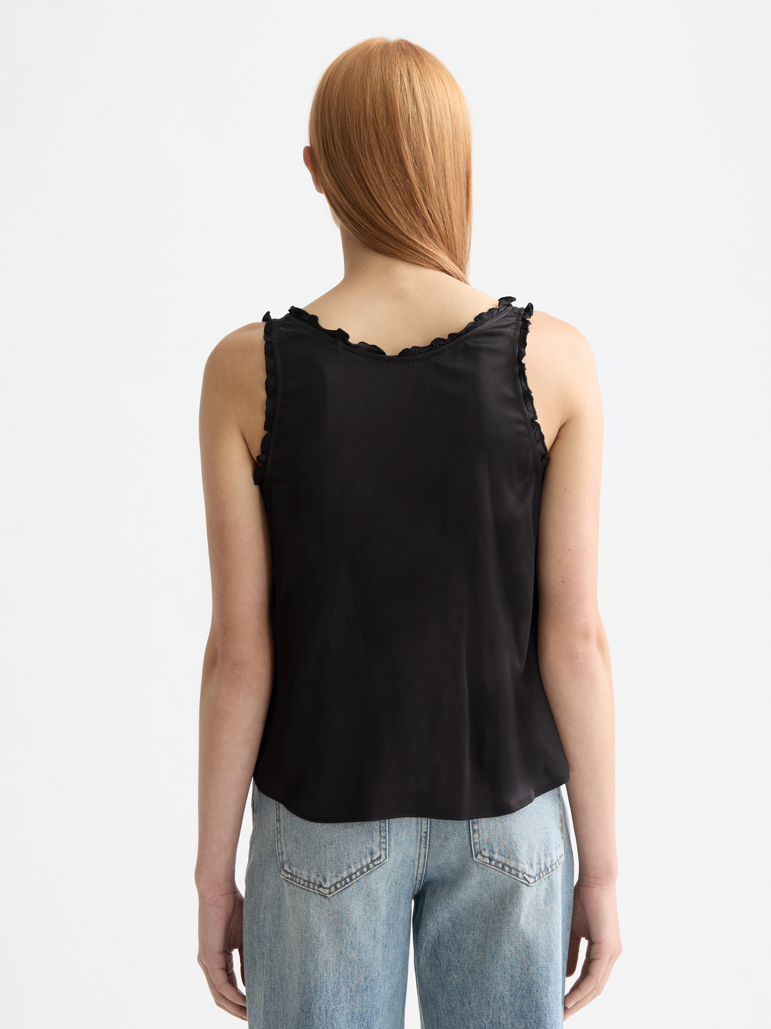 Scotch & Soda V-neck ruffle tank top with sleeveless design and feminine ruffle details, displayed on a model.