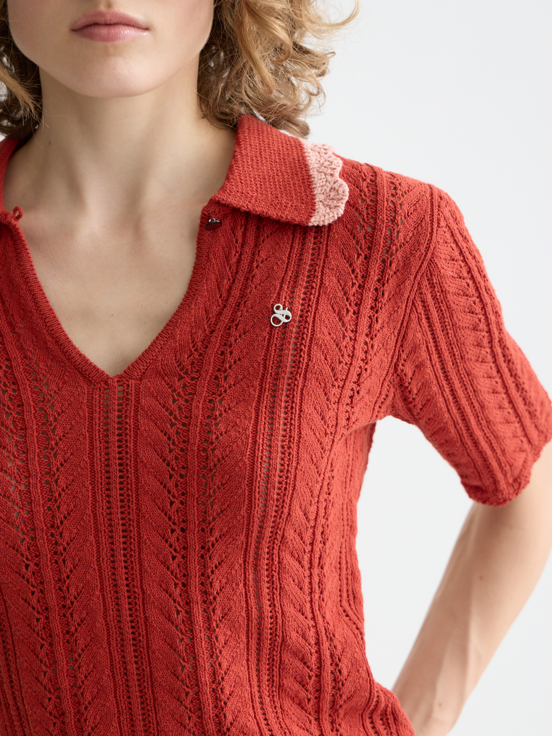 Pointelle knit collared polo shirt by SCOTCH & SODA, featuring a textured pattern and classic collar detail.
