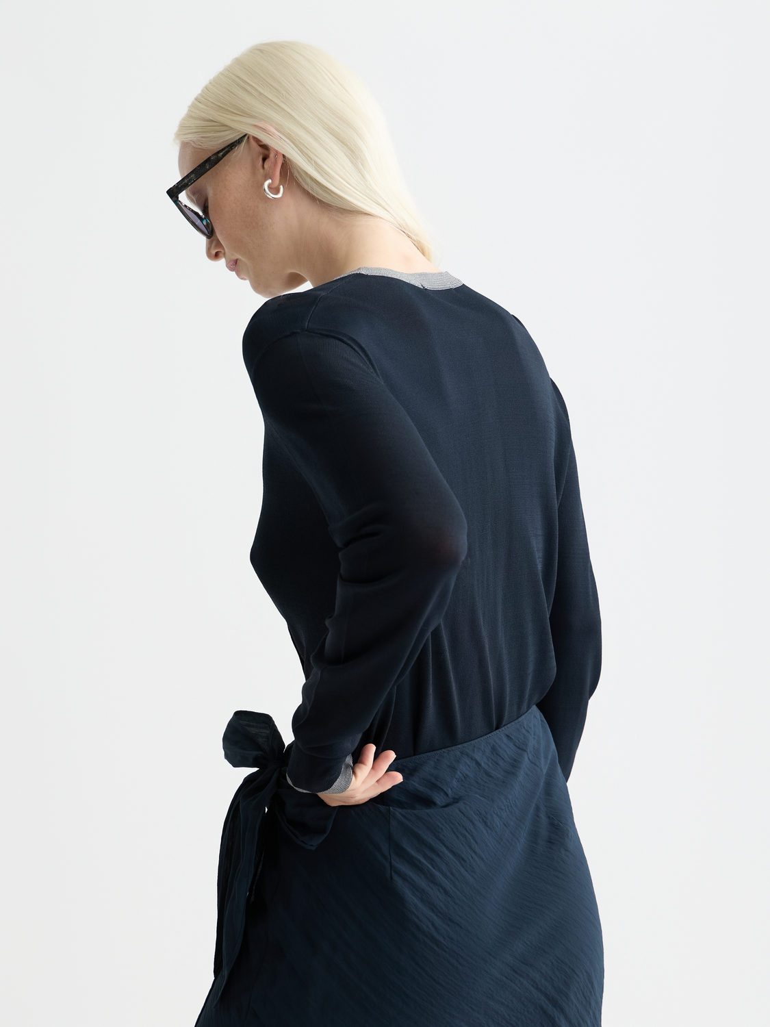 SCOTCH & SODA crewneck cardigan made of knitwear, shown from the back with a textured, cozy design and ribbed hem.