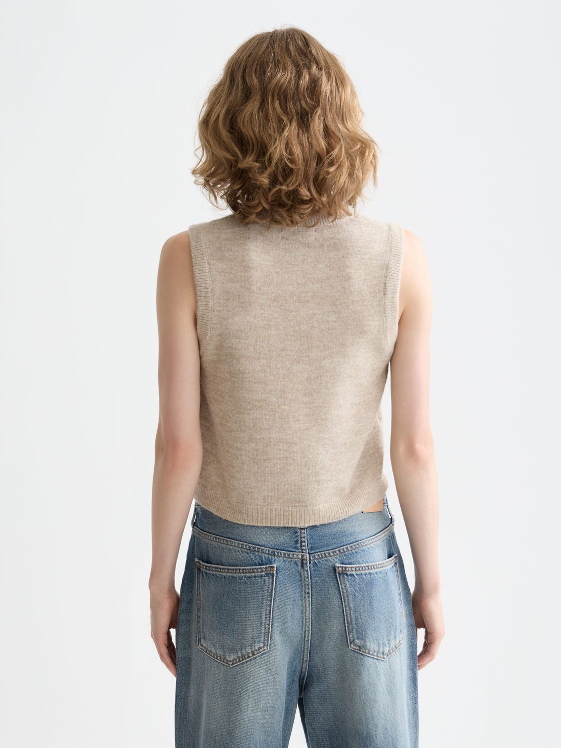 Scotch & Soda knitted tank top, soft knitwear with a close-up view of the back design and textured fabric.