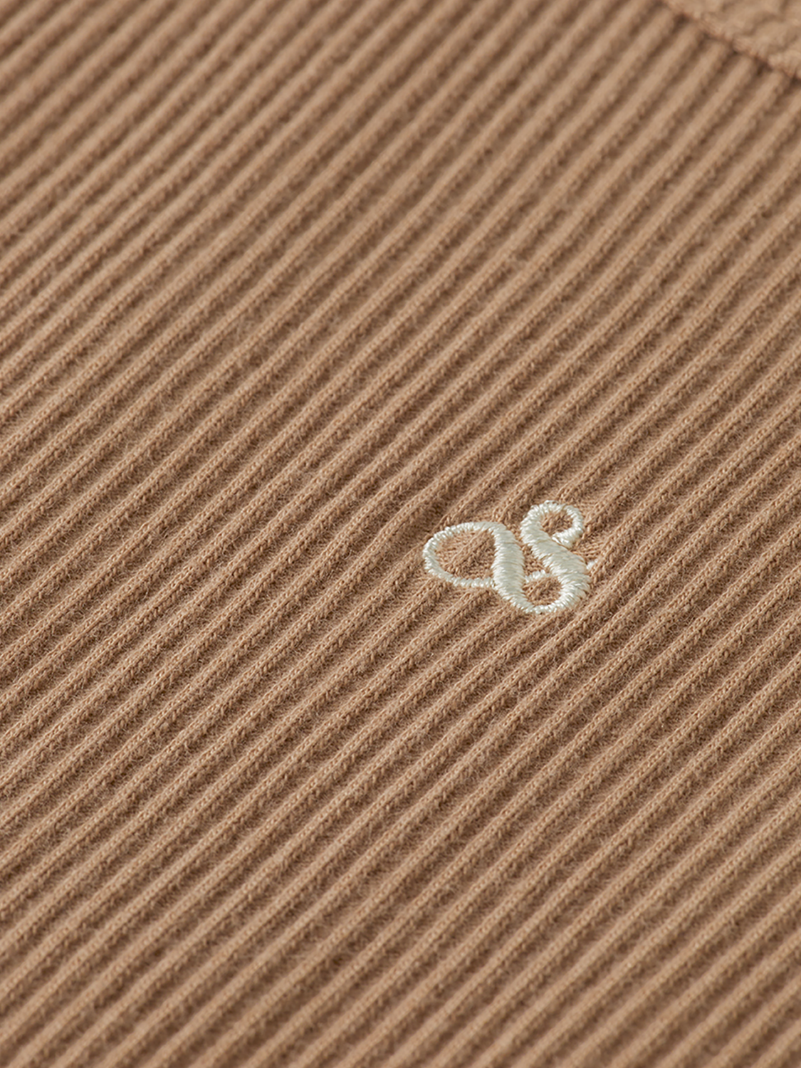 Ribbed beige tank top from SCOTCH & SODA with a fitted style and sleeveless design.