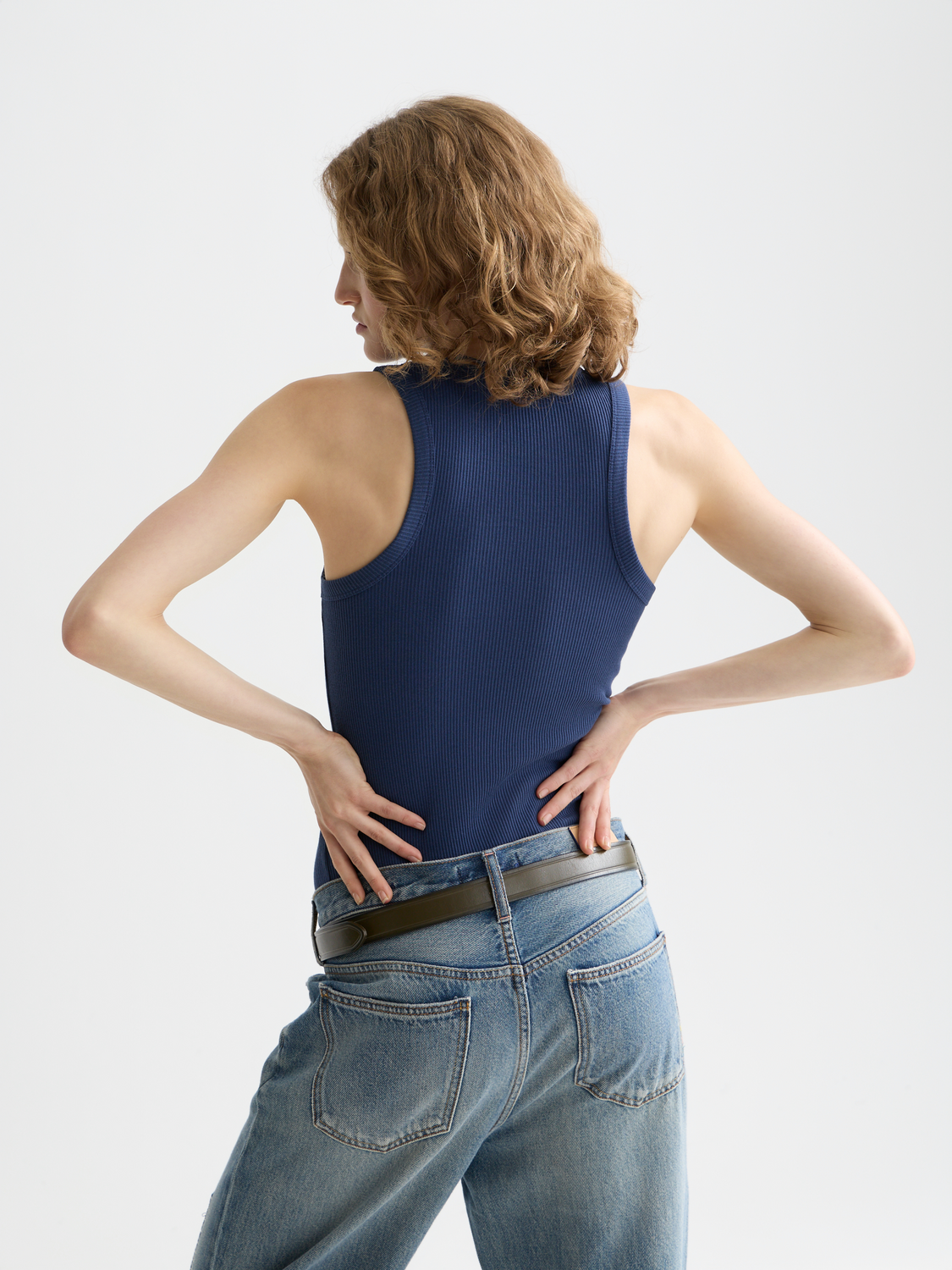 Black ribbed tank top from Scotch & Soda with a fitted design, shown from the back.