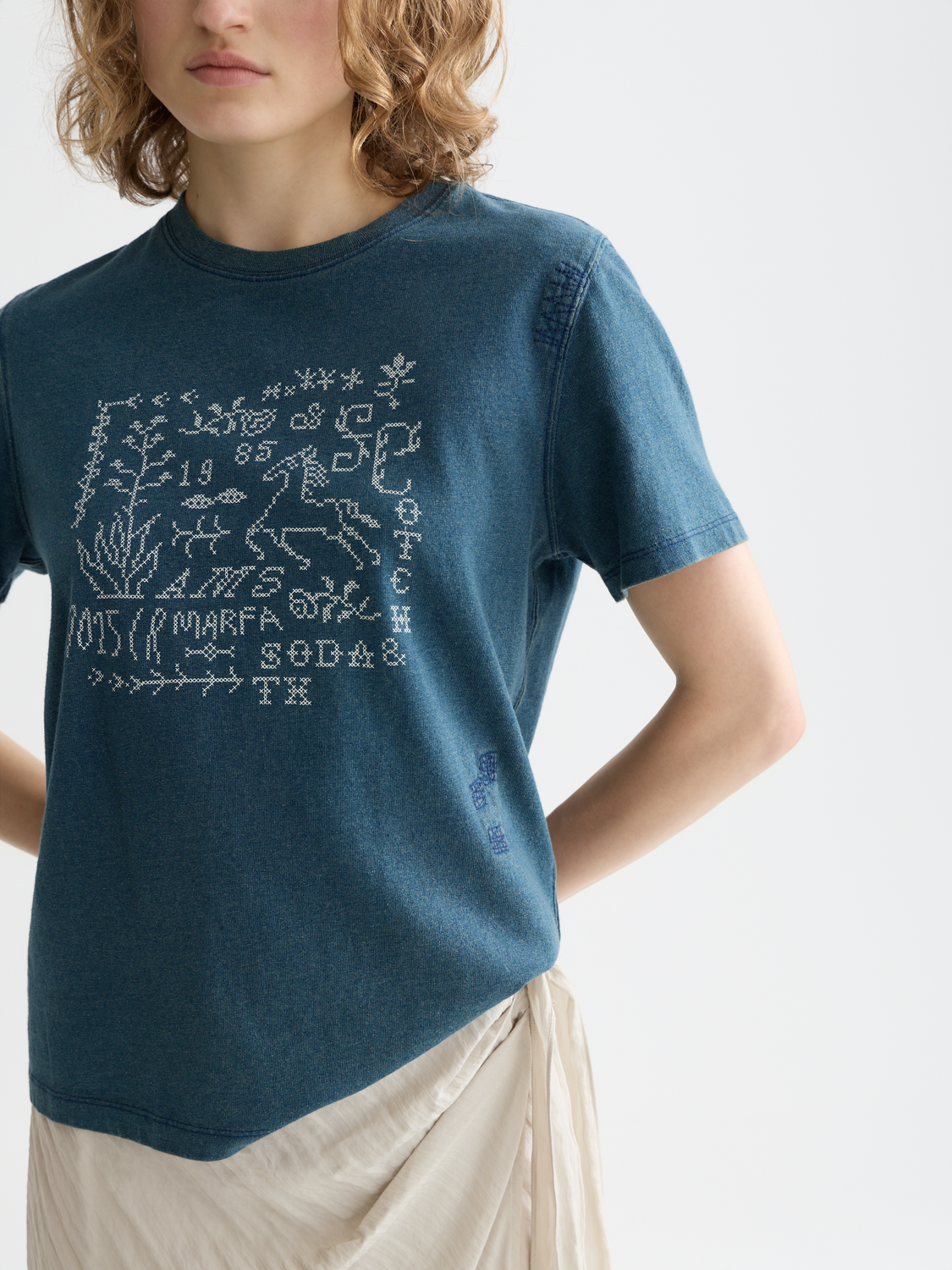 Graphic Scotch & Soda short sleeve t-shirt featuring vibrant print and casual fit on a neutral background.