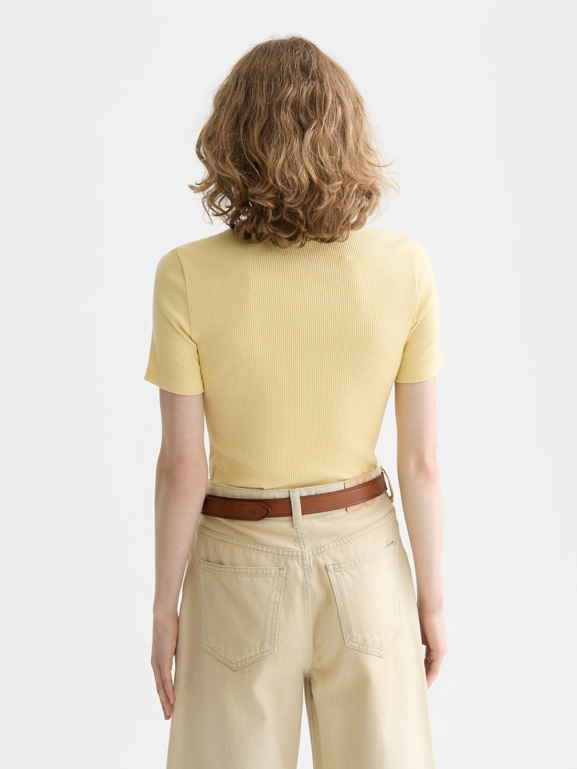 Black Scotch & Soda short sleeve mock neck rib top displayed from the back, showing the fitted design and ribbed texture.