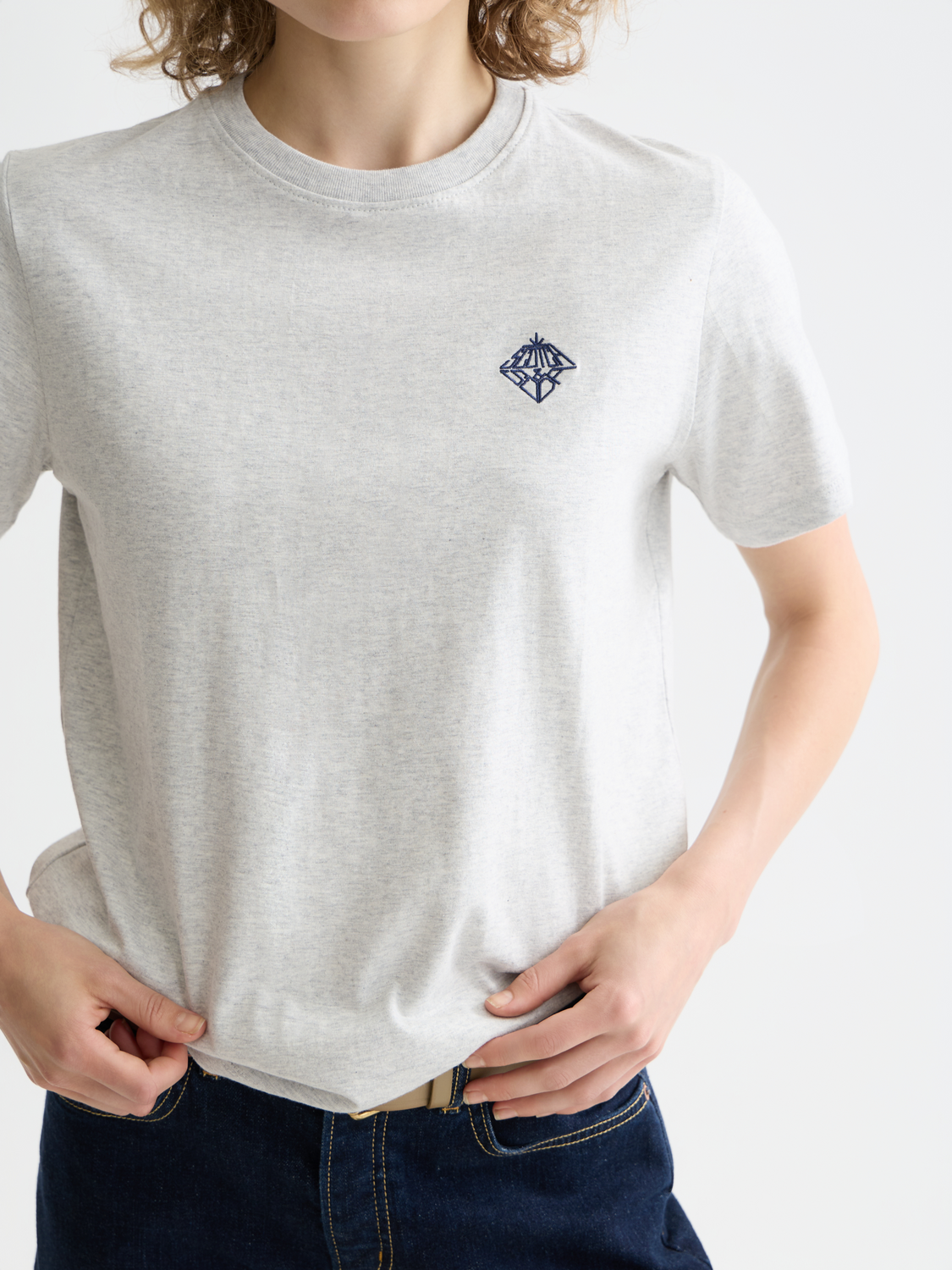 Embroidered Scotch & Soda short-sleeve T-shirt with colorful floral design on light fabric, casual stylish men's top.