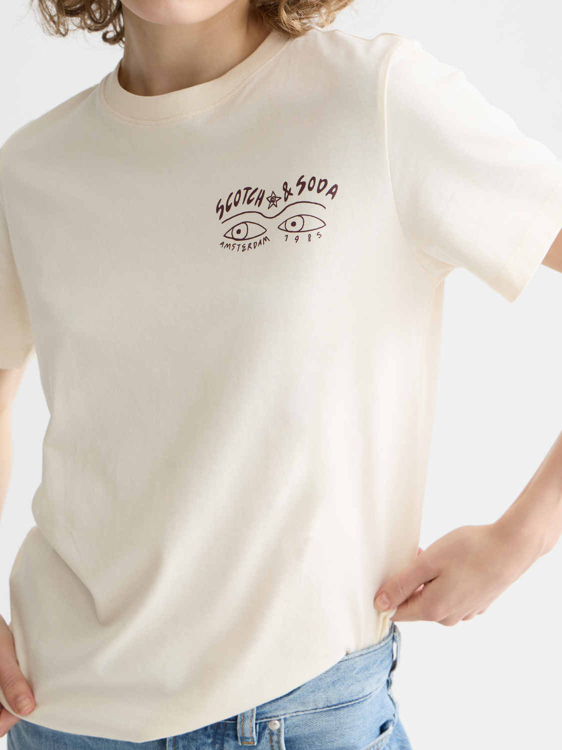 Short sleeve Scotch & Soda chest artwork t-shirt with colorful graphic design on soft fabric.