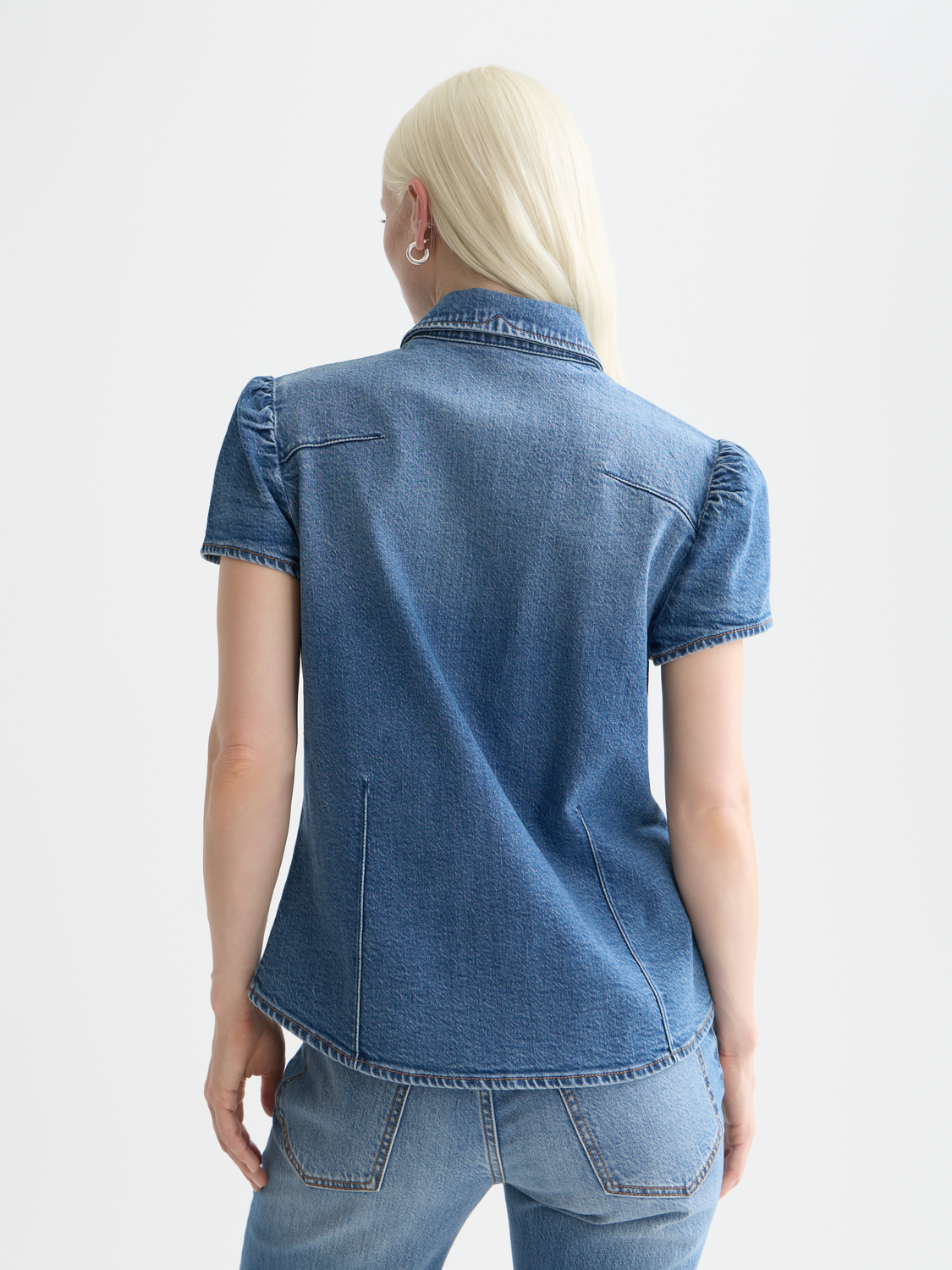 Blue fitted denim shirt by Scotch & Soda, short-sleeve style with back view, showcasing classic denim design and stitching details.