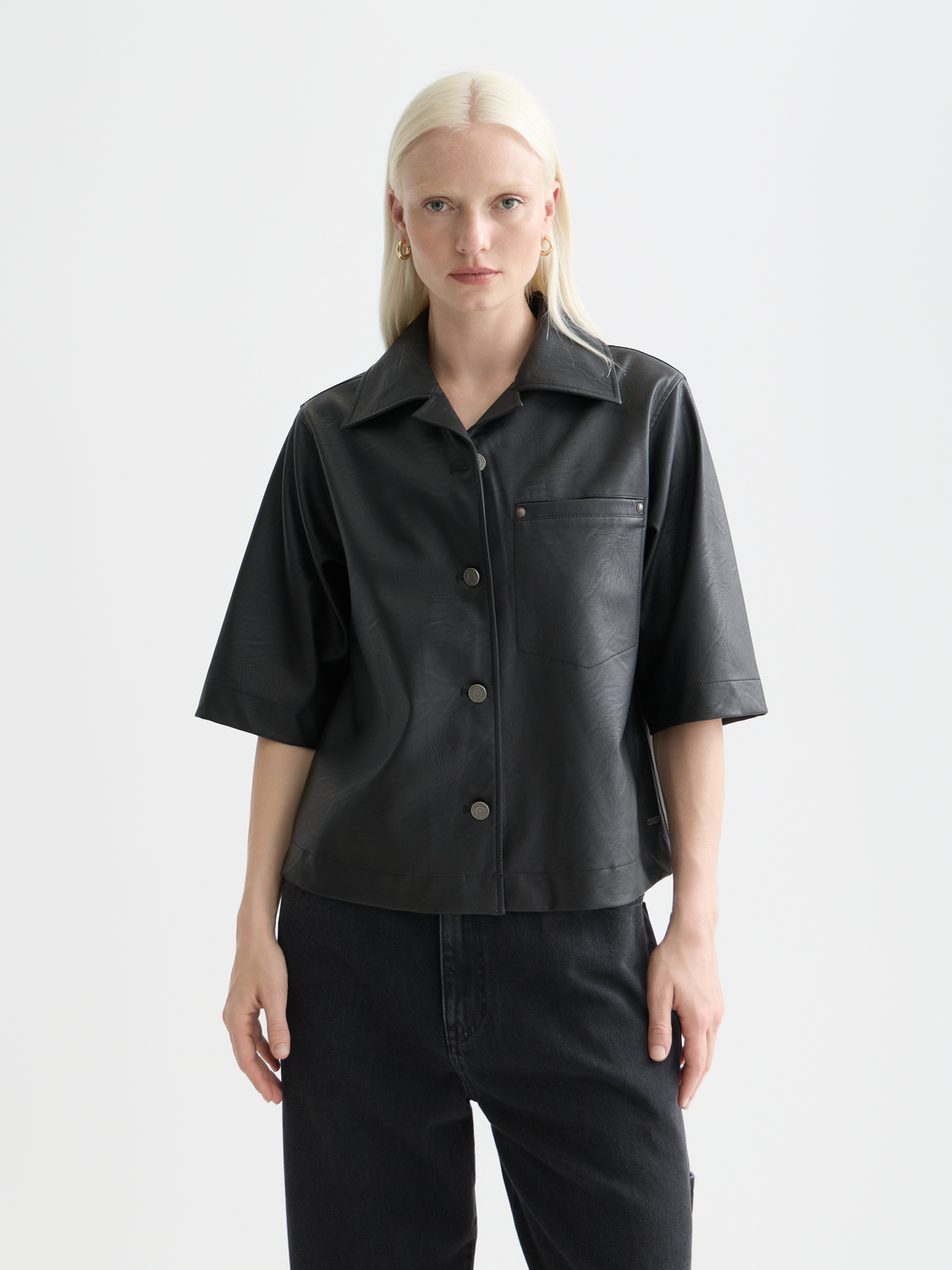 Faux leather short-sleeve shirt by Scotch & Soda, front view showing collar and sleek leather texture.