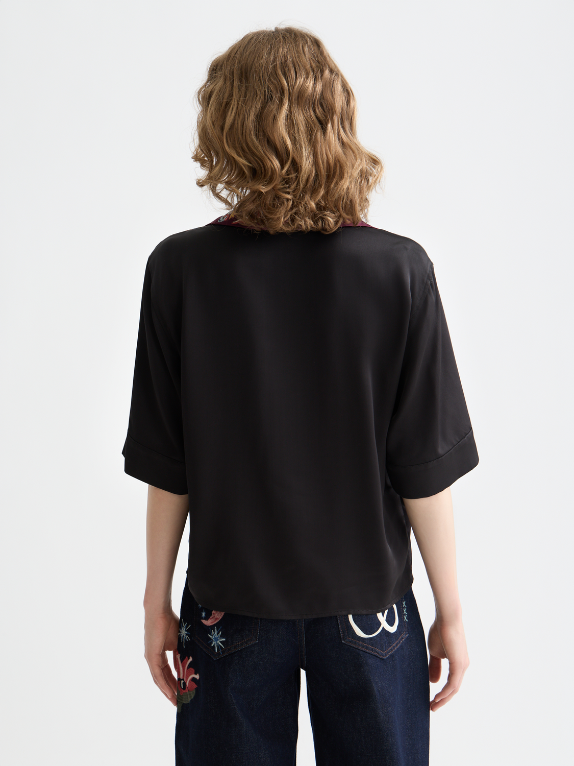 Embroidered short sleeve shirt by Scotch & Soda featuring colorful floral embroidery on back and lightweight fabric.