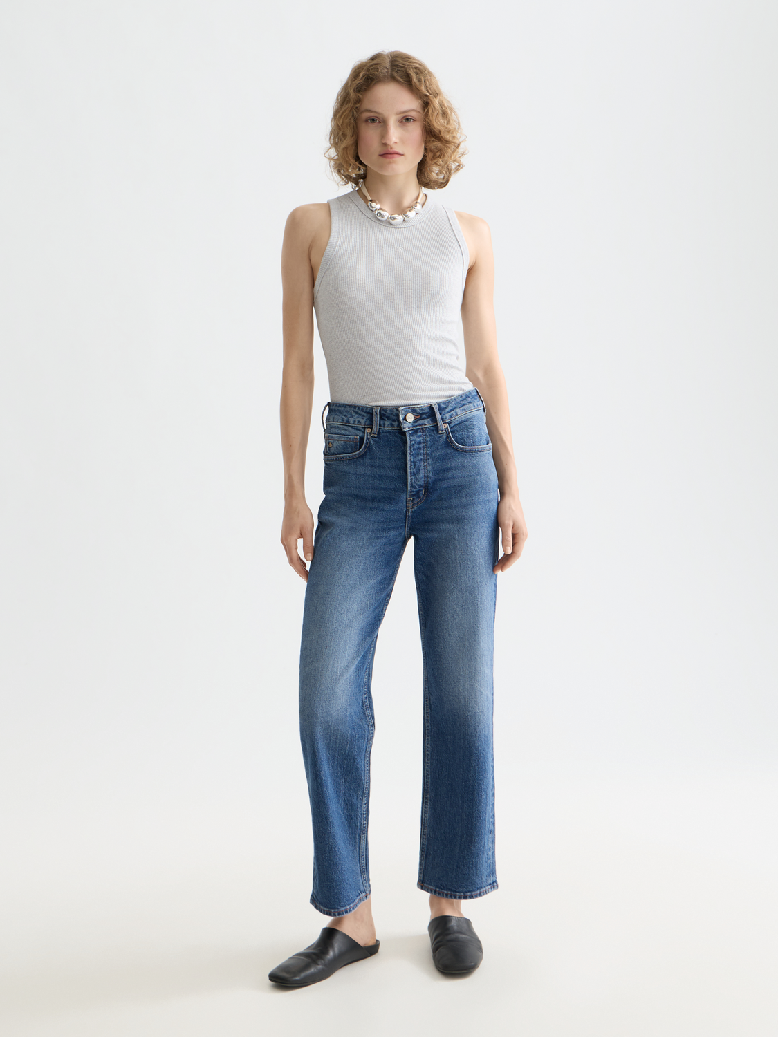Ribbed racer tank top by Scotch & Soda, featuring a fitted design in neutral color, displayed on a mannequin.
